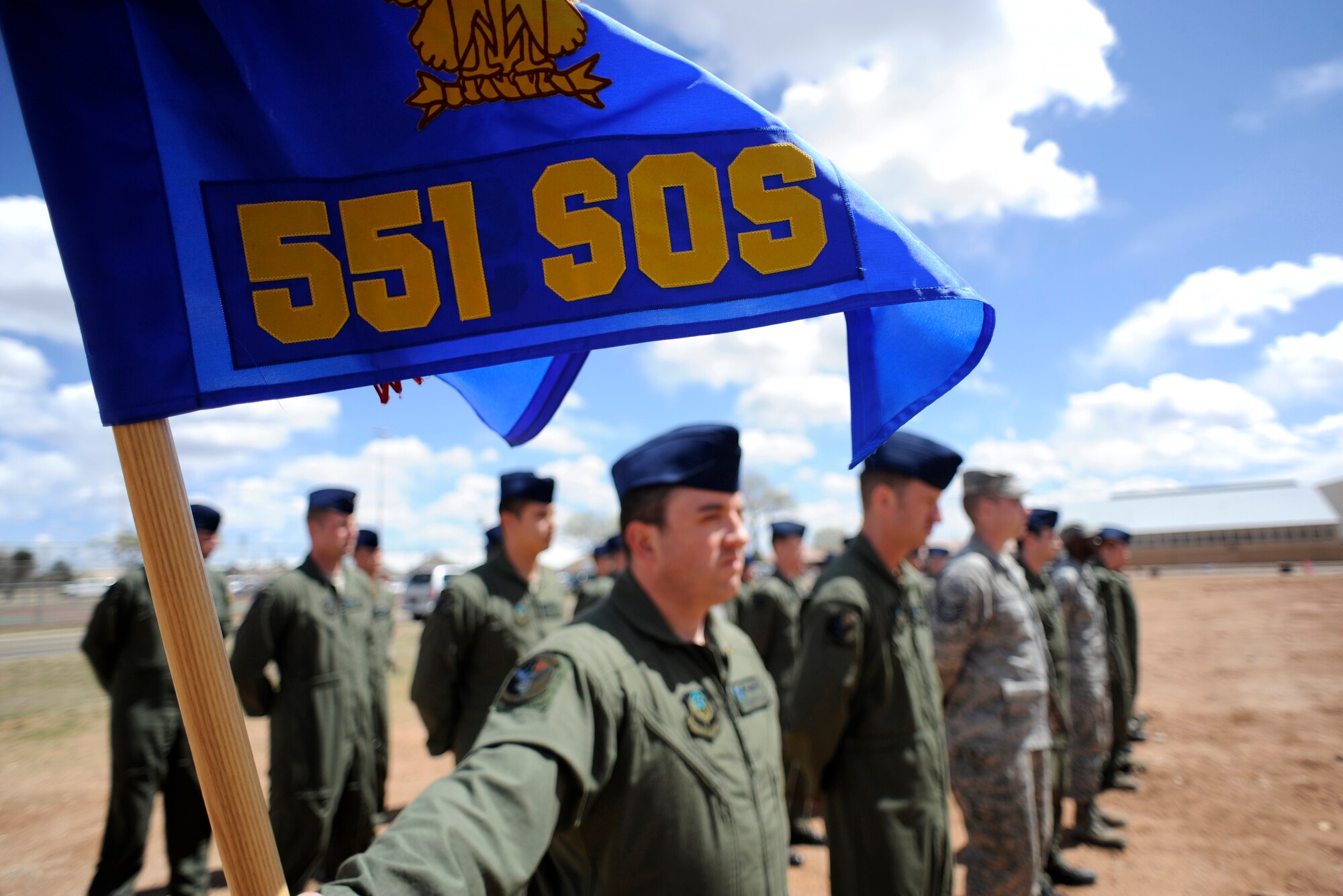 Airmen assigned to the 551st Special Operations Squadron at Cannon Air Force Base stand at parade rest before a ribbon cutting ceremony for a new training facility April 2. The 551st SOS began as an Air Force Special Operations Training Center Detachment at Cannon when it stood up October 2008 and was redesignated the 551 SOS July 2009. (U.S. Air Force Photo by Senior Airman Evelyn Chavez)