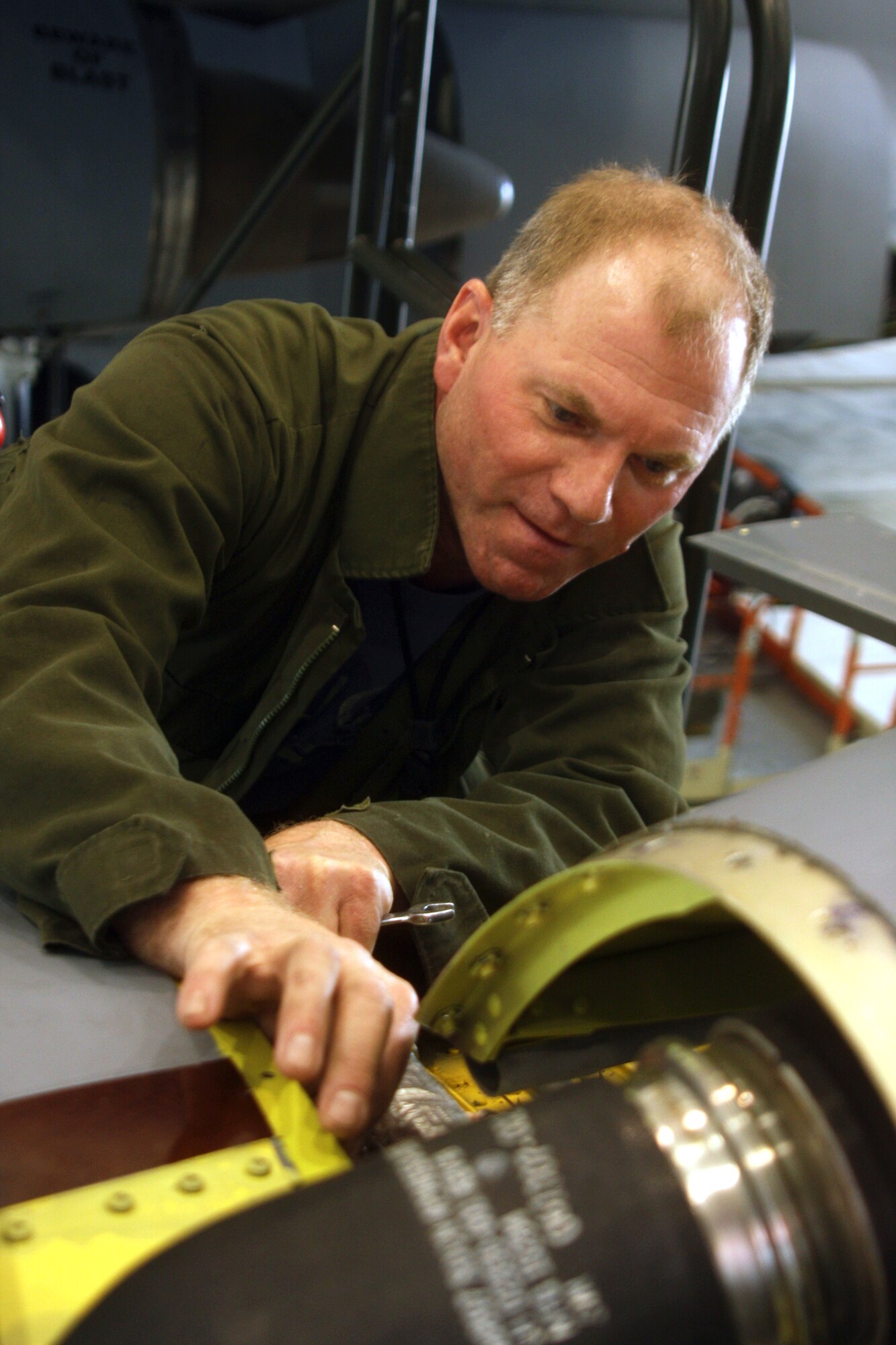 WRIGHT-PATTERSON AIR FORCE BASE, Ohio – Master Sgt. Andrew VanErt, 445th Maintenance Squadron, installs an inlet ring cowl on a C-5 Galaxy engine March 28. (U.S. Air Force photo/Senior Airman Mikhail Berlin)