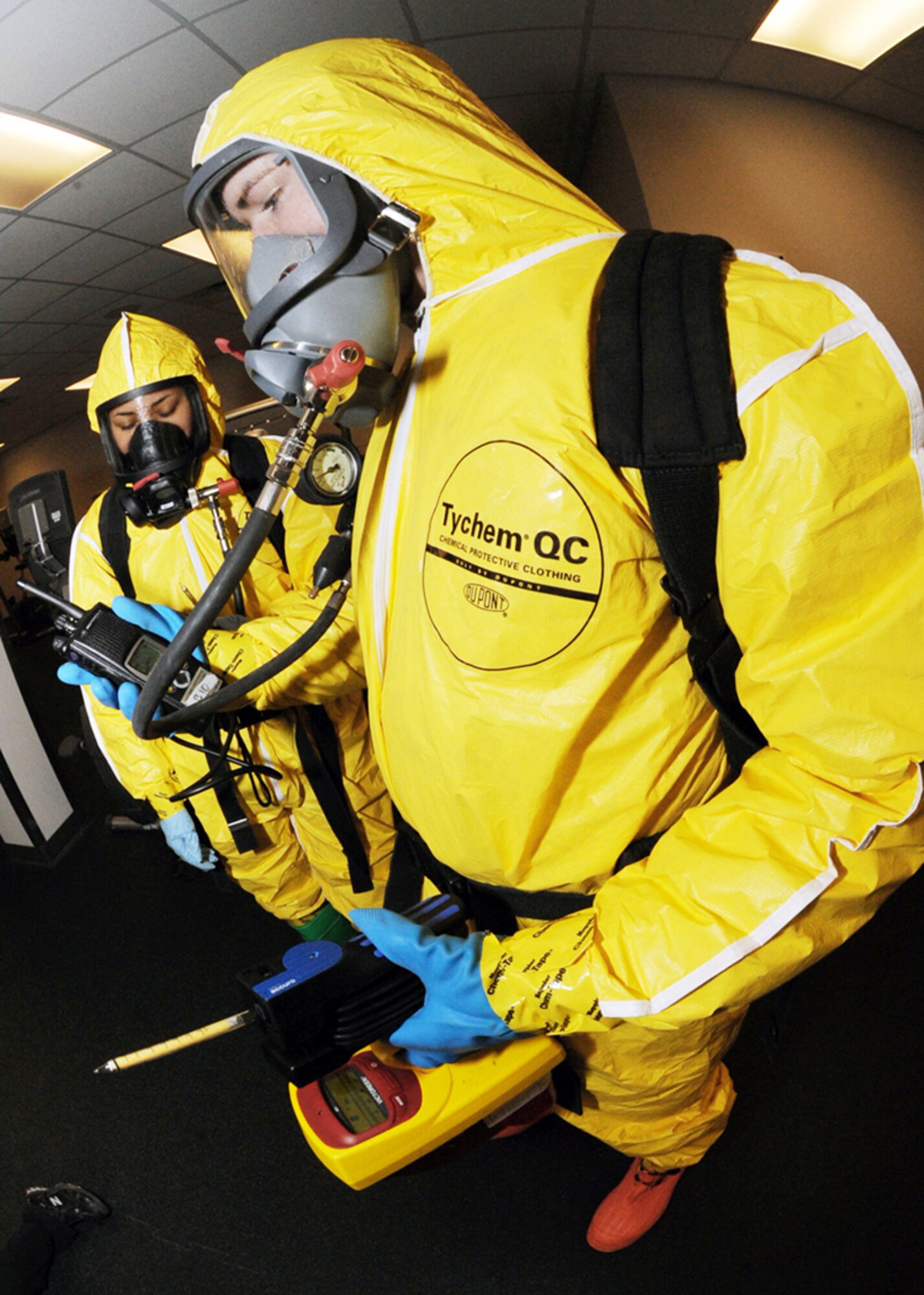 Senior Airman Jimmy VanHuss and Airman 1st Class Anjelika Rodriguez use drager tubes to detect chemicals in a contaminated area during the major accident response exercise March 26, 2010, at Minot Air Force Base, N.D. The exercise prepared base members for possible real-world situations as well as testing communication and emergency procedures. Airmen VanHuss and Rodriguez are both 5th Medical Operations Squadron bioenvironmental engineering technicians. (U.S. Air Force photo/Senior Airman Sharida Jackson)