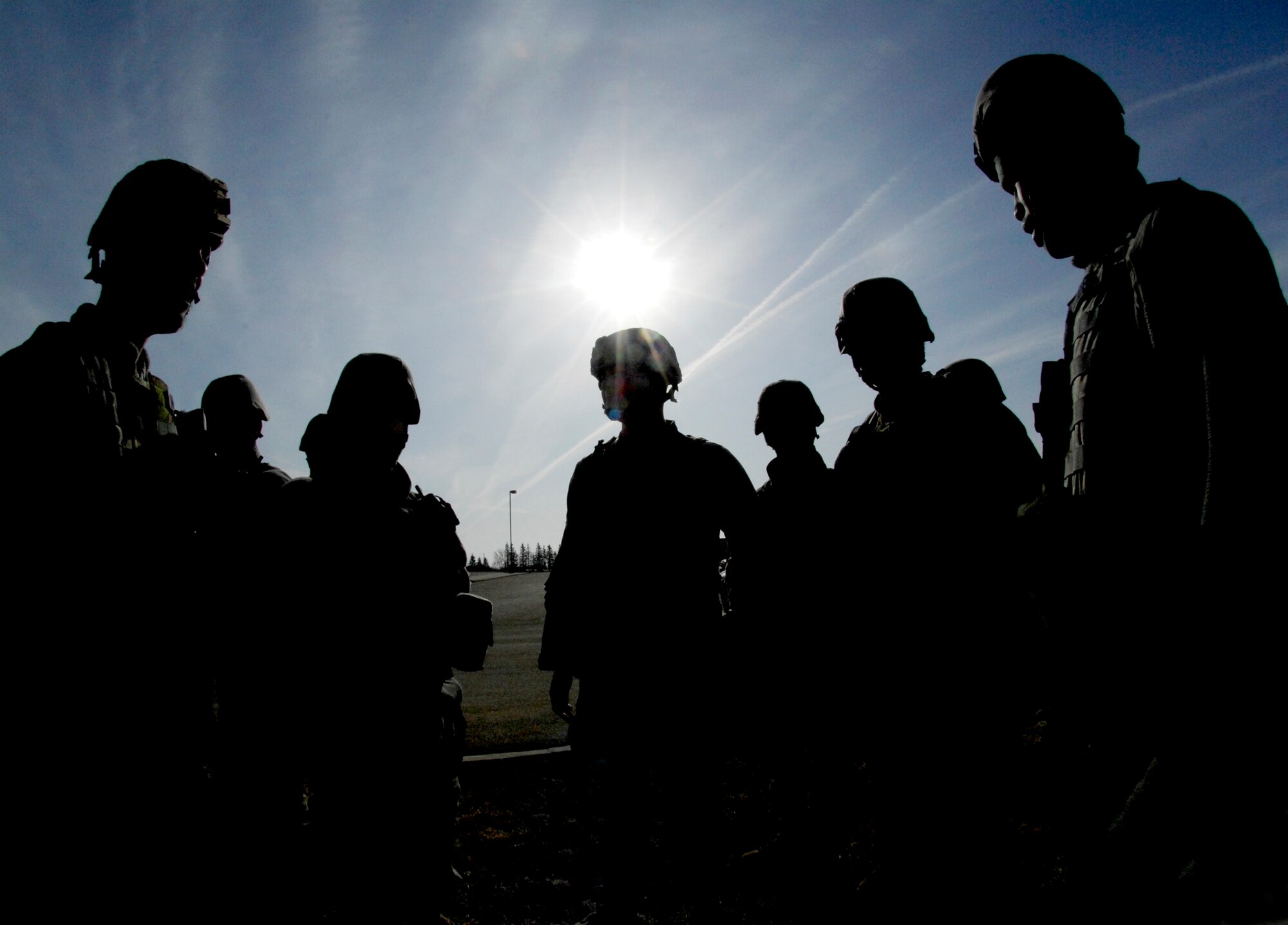 Members of the 5th Security Forces Squadron assemble prior to entering the McAdoo Fitness Center in response to the major accident response exercise March 26, 2010, at Minot Air Force Base, N.D. The exercise prepared base members for possible real-world situations as well as testing communication and emergency procedures. (U.S. Air Force photo/Senior Airman Jesse Lopez)