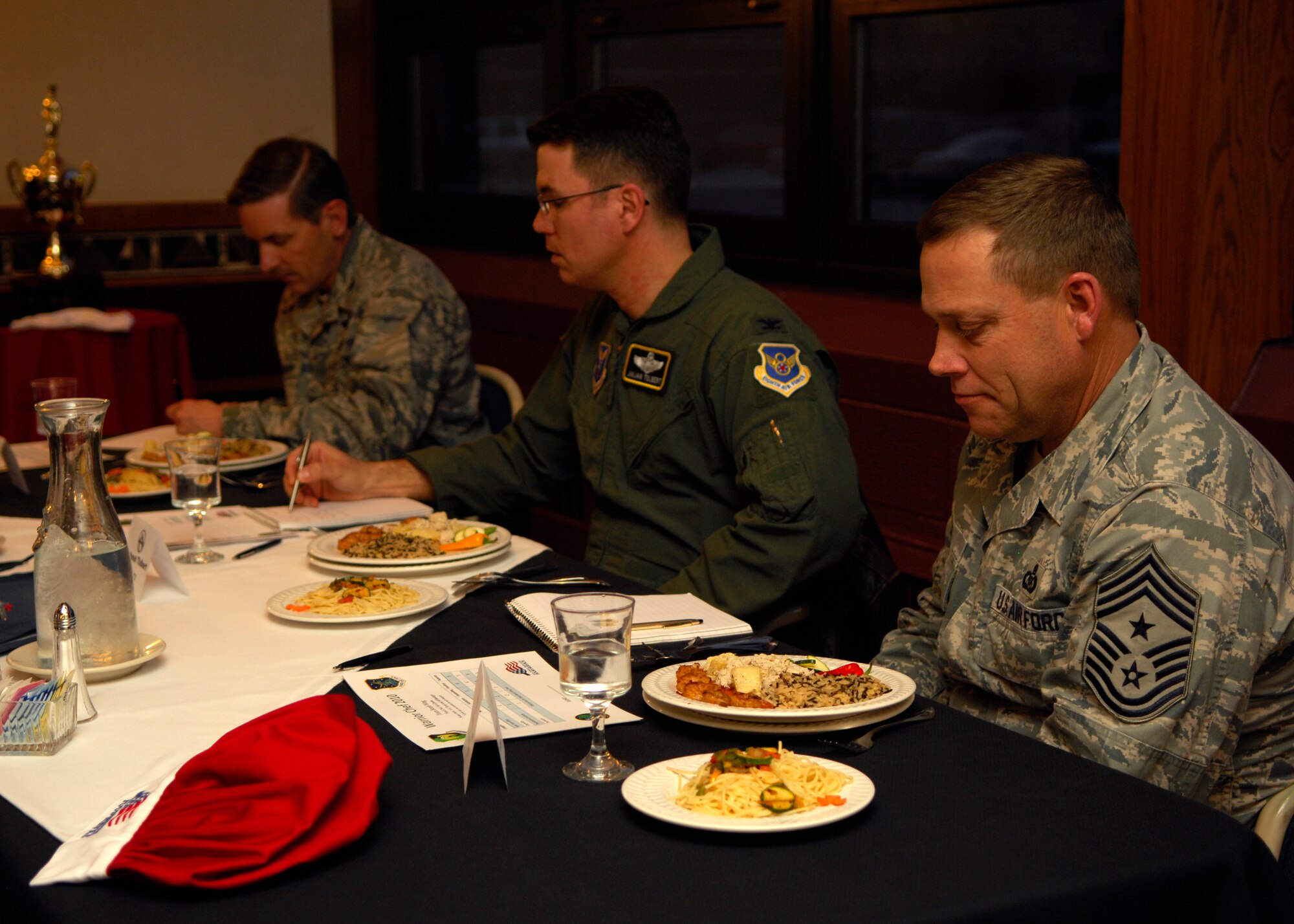 MINOT AIR FORCE BASE, N.D. – Chief Master Sgt. Martin Smith, 5th Bomb Wing command chief, Col. Julian Tolbert, 5th Bomb Wing vice commander, and Col. James Gallagher, 5th Mission Support Group commander, judge the dish prepared by the 91st Missile Wing team during a Warrior Chef competition held at the Dakota Inn dining facility on Minot Air Force Base March 30. While tasting the dishes of both teams the judges critiqued and asked questions about the dishes. (U.S. Air Force photo by Airman 1st Class Ashley N. Avecilla)