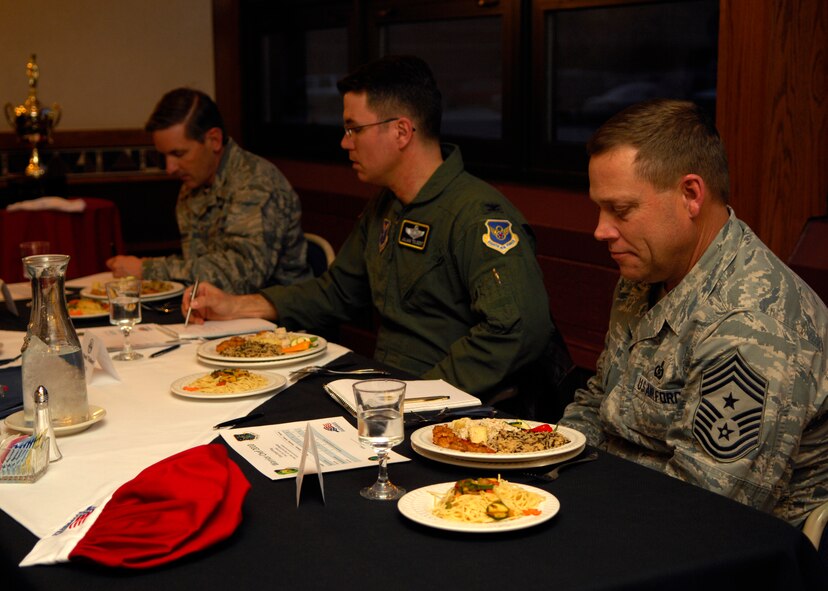 MINOT AIR FORCE BASE, N.D. – Chief Master Sgt. Martin Smith, 5th Bomb Wing command chief, Col. Julian Tolbert, 5th Bomb Wing vice commander, and Col. James Gallagher, 5th Mission Support Group commander, judge the dish prepared by the 91st Missile Wing team during a Warrior Chef competition held at the Dakota Inn dining facility on Minot Air Force Base March 30. While tasting the dishes of both teams the judges critiqued and asked questions about the dishes. (U.S. Air Force photo by Airman 1st Class Ashley N. Avecilla)