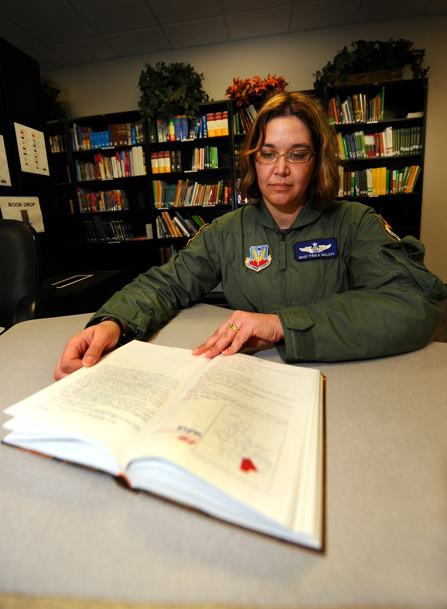 OFFUTT AIR FORCE BASE, Neb. -- Master Sgt. Paula Malott, an Arabic Linguist and chief of Standardization and Evaluations with the 97th Intelligence Squadron, reads a book written in Arabic at the Language Learning Center here March 31. Linguists like Sergeant Malott utilize the LLC and its many resources to maintain language proficiency. Sergeant Malott has spent her 20-plus year career with the Air Force as a linguist and has deployed more than 20 times in support of contingency operations. U.S. Air Force photo by Josh Plueger