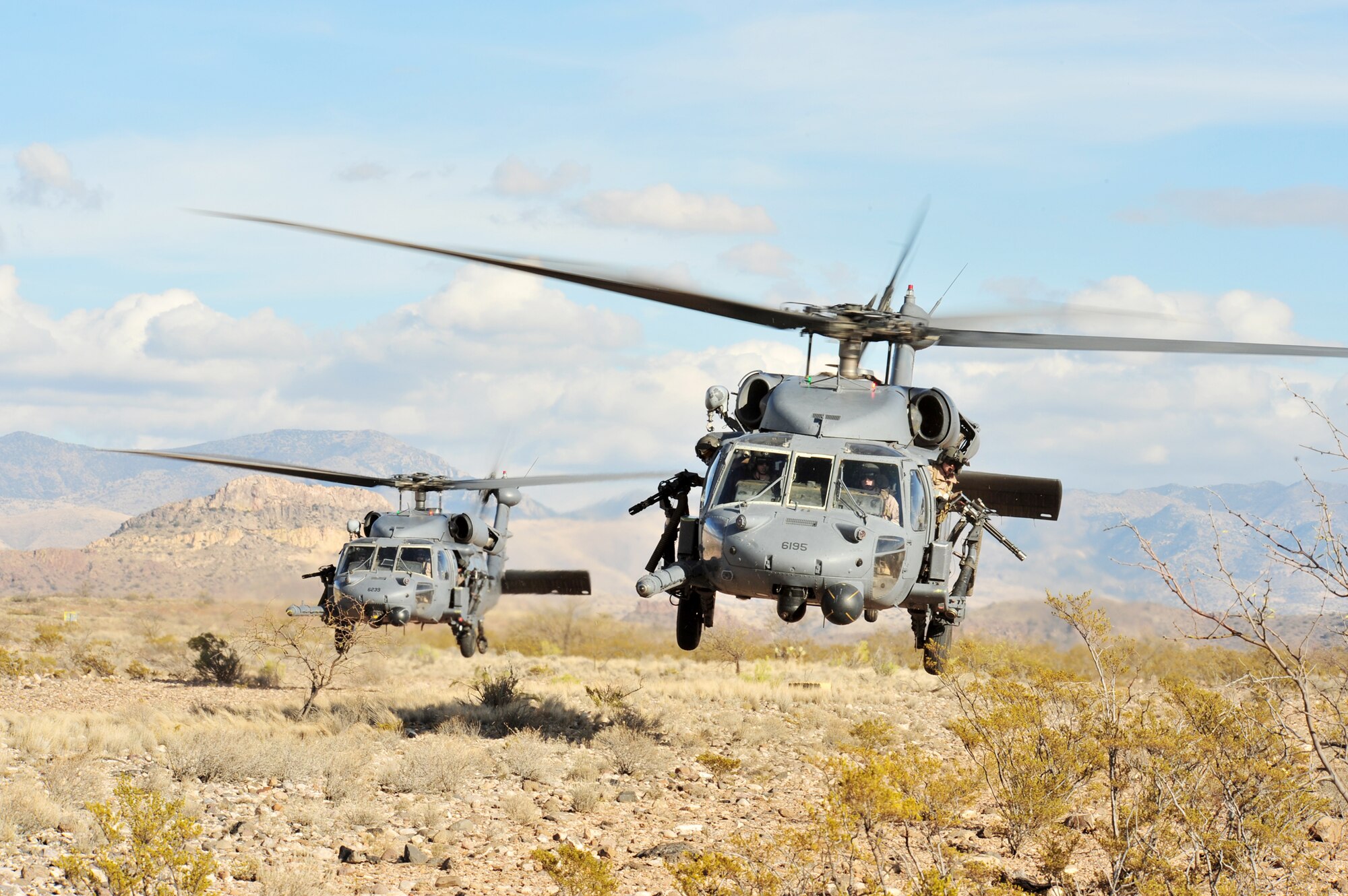 Two HH-60G Pave Hawk helicopters land during Exercise Angel Thunder 2008. More than 800 ground recovery members took part in Angel Thunder 2008, the world's largest personnel recovery and combat search and rescue exercise. Angel Thunder 2010 is scheduled for April 12 through 23 at Davis-Monthan Air Force Base, Ariz. (U.S. Air Force photo/Senior Airman Noah R. Johnson)