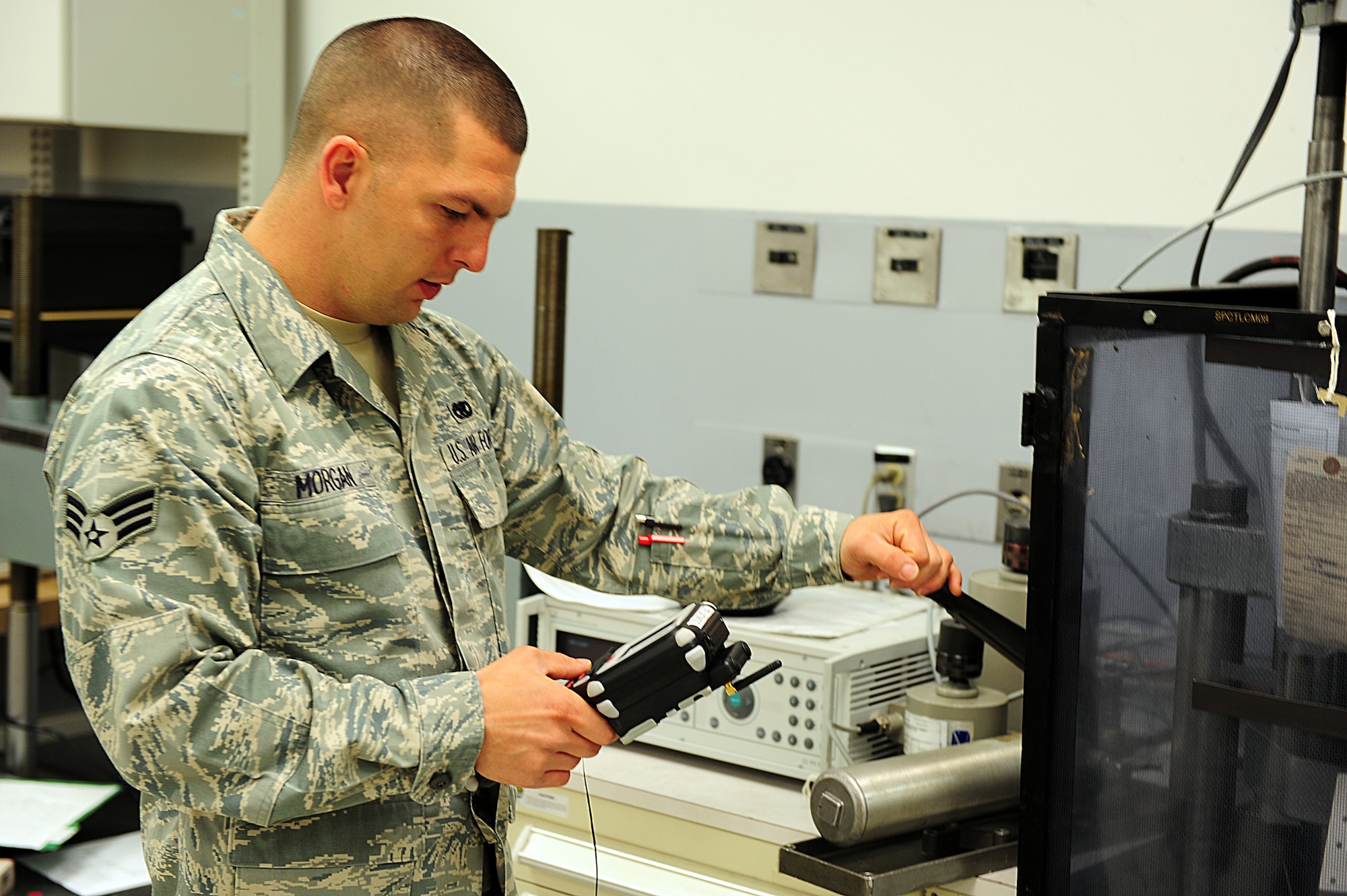 SHAW AIR FORCE BASE, S.C. -- Senior Airman David Morgan, 20th Component Maintenance Squadron equipment technician, checks the calibration of a load cell here March 30. The Precision Measurement Equipment Laboratory calibrates a wide variety of tools and equipment to ensure that the equipment is ready to use. (U.S. Air Force photo/Airman 1st Class Neil D. Warner)