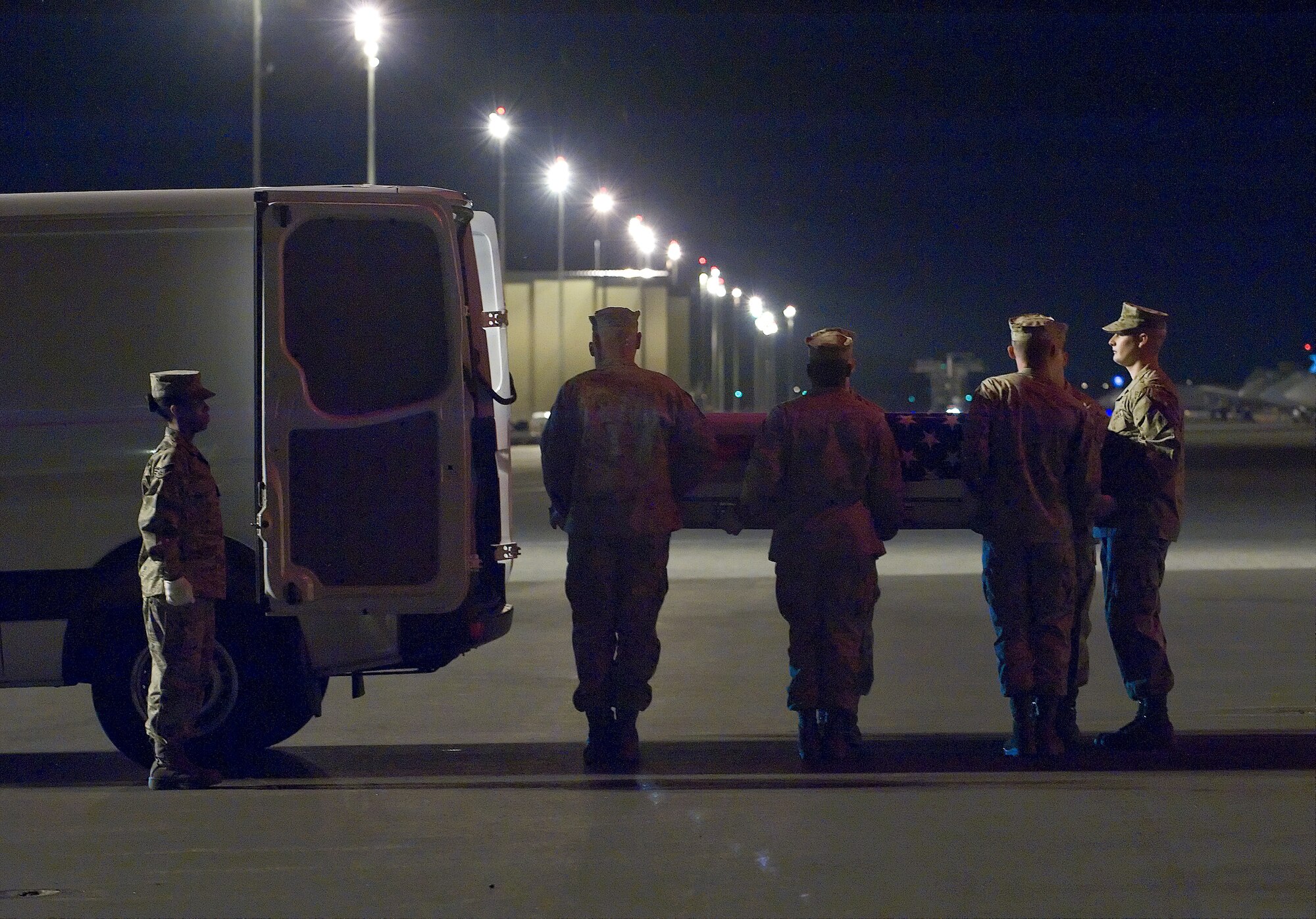 A U.S. Marine Corps carry team transfers the remains of Marine Corps Lance Cpl. Justin Wilson, of Palm City, Fla., at Dover Air Force Base, Del., March 24. Wilson was assigned to the 3rd Battalion, 10th Marine Regiment, 2nd Marine Division, II Marine Expeditionary Force, Camp Lejeune, N.C. (U.S. Air Force photo/Brianne Zimny)