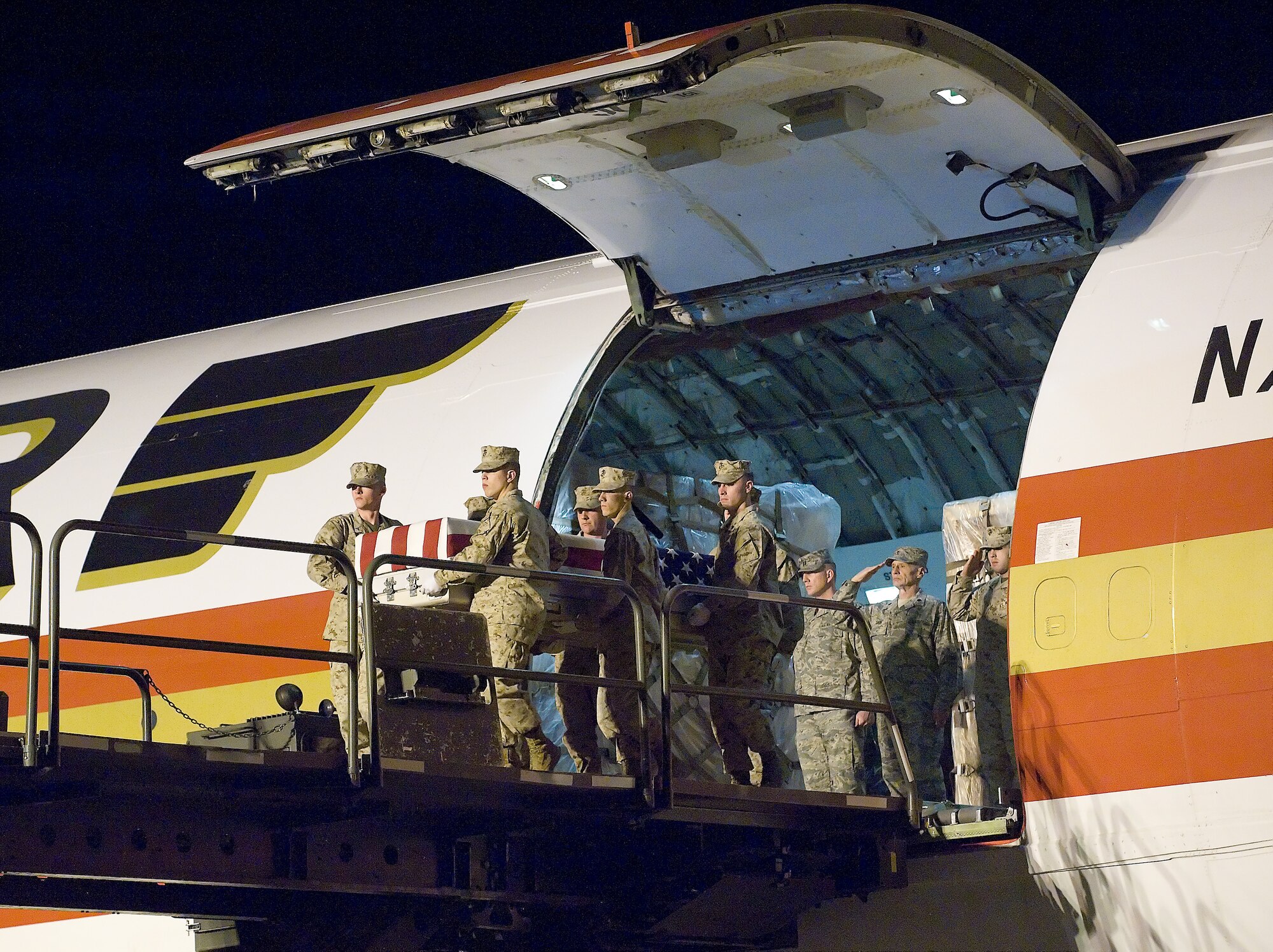 A U.S. Marine Corps carry team transfers the remains of Marine Corps Lance Cpl. Justin Wilson, of Palm City, Fla., at Dover Air Force Base, Del., March 24. Wilson was assigned to the 3rd Battalion, 10th Marine Regiment, 2nd Marine Division, II Marine Expeditionary Force, Camp Lejeune, N.C. (U.S. Air Force photo/Brianne Zimny)