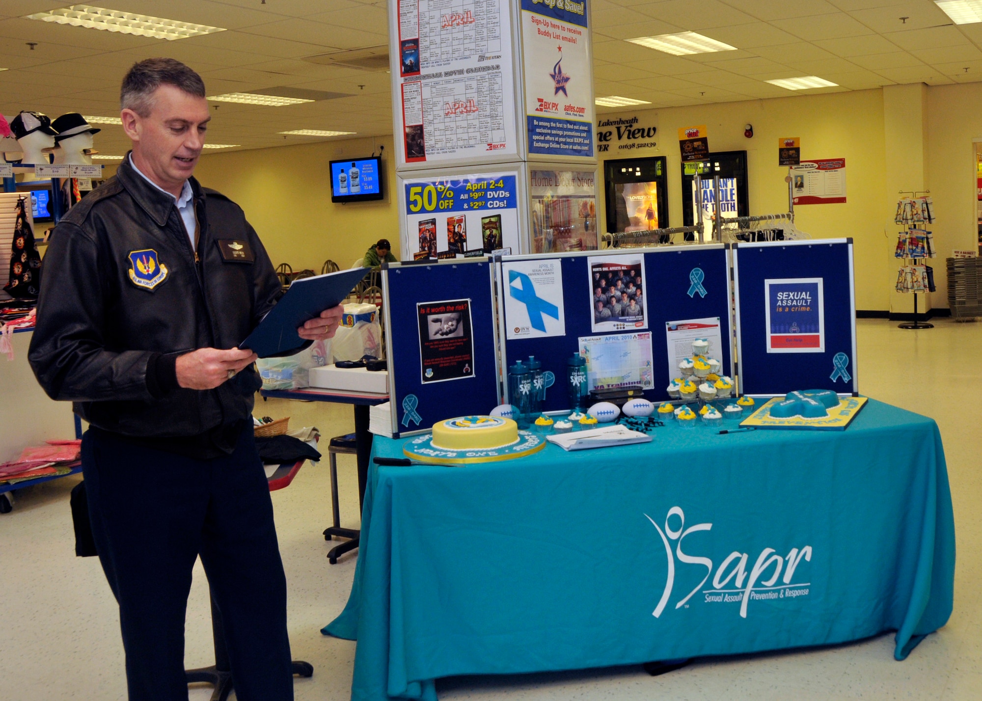 Col. Lawrence Reed, 48th Fighter Wing vice commander announces the beginning of 2010 Sexual Assault Awareness Month at the base exchange at RAF Lakenheath, England, April 5. For more information see the related link Lakenheath community bulletins. (U.S. Air Force Photo/Airman 1st Class Eboni Knox)