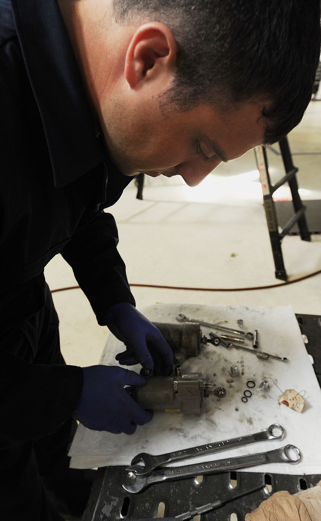 MOODY AIR FORCE BASE, Ga. -- Staff Sgt. Benjamin McIntosh, 23rd Aircraft Maintenance Squadron aerospace propulsion craftsman, inspects a verbal guide vein actuator during an inspection of an A-10C Thunderbolt II here March 24. The verbal guide vein actuator controls how much air goes into the engine and operates in different power settings. (U.S. Air Force photo by Airman 1st Class Joshua Green/RELEASED)