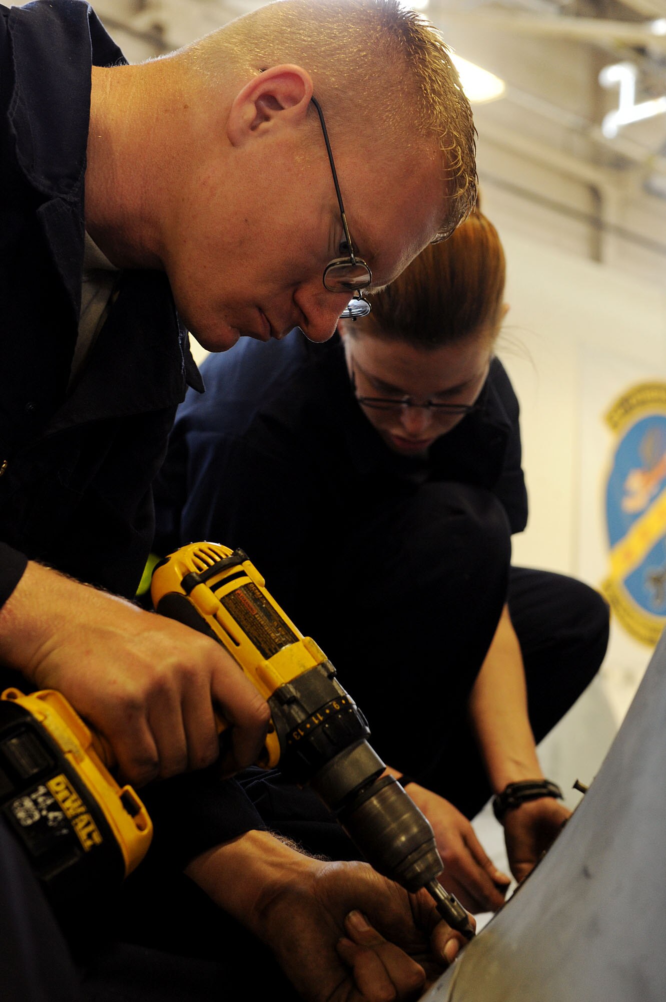 MOODY AIR FORCE BASE, Ga. -- Airman 1st Class Patrick Peloquin, 23rd Aircraft Maintenance Squadron crew chief, uses an electric screw driver to remove screws on an A-10C Thunderbolt II aircraft during an inspection here March 24. These aircraft undergo this 10-day inspection process after reaching 500 flight hours to stay up-to-date and minimize possible problems that can occur during flight. (U.S. Air Force photo by Airman 1st Class Joshua Green/RELEASED)