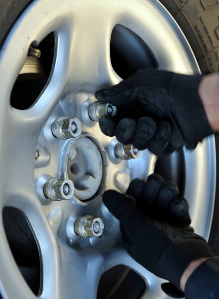 MOODY AIR FORCE BASE, Ga. -- Airman 1st Class Travias Ellison, 23rd Logistics Readiness Squadron vehicle maintenance apprentice, tightens bolts of a tire onto an emergency response vehicle March 29. (U.S Air Force photo by Staff Sgt. Schelli Jones/RELEASED)