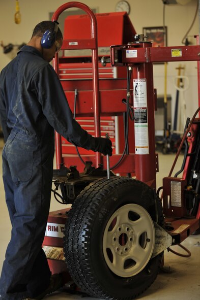 MOODY AIR FORCE BASE, Ga. -- Airman 1st Class Travias Ellison, 23rd Logistics Readiness Squadron vehicle maintenance apprentice, repairs a valve stem on a tire for an emergency response vehicle here March 29. These emergency vehicles include ambulances, security forces response vehicles, crash recovery vehicles, civil engineering vehicles and fire trucks, all responsible for responding to various on- and off-base situations that need their assistance. (U.S Air Force photo by Staff Sgt. Schelli Jones/RELEASED)