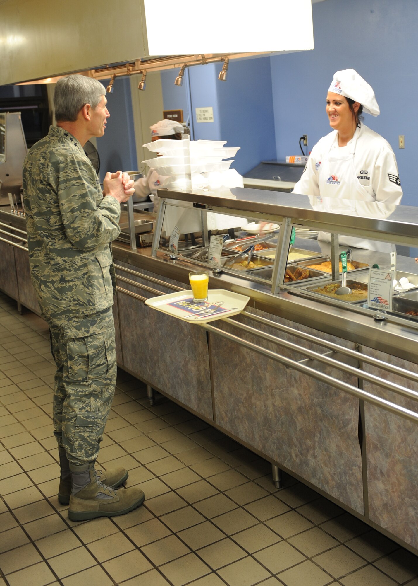 MINOT AIR FORCE BASE, N.D. -- Air Force Chief of Staff Gen. Norton Schwartz places his food order with Senior Airman Brittany Greene, 5th Force Support Squadron first cook, at the Dakota Inn dining facility here April 2.  General Schwartz’s visit was to reassure the men and women of Minot Air Force Base that the Air Force has complete confidence in their mission and their role in the nuclear enterprise.  (U.S. Air Force photo by Staff Sgt. Keith Ballard)
