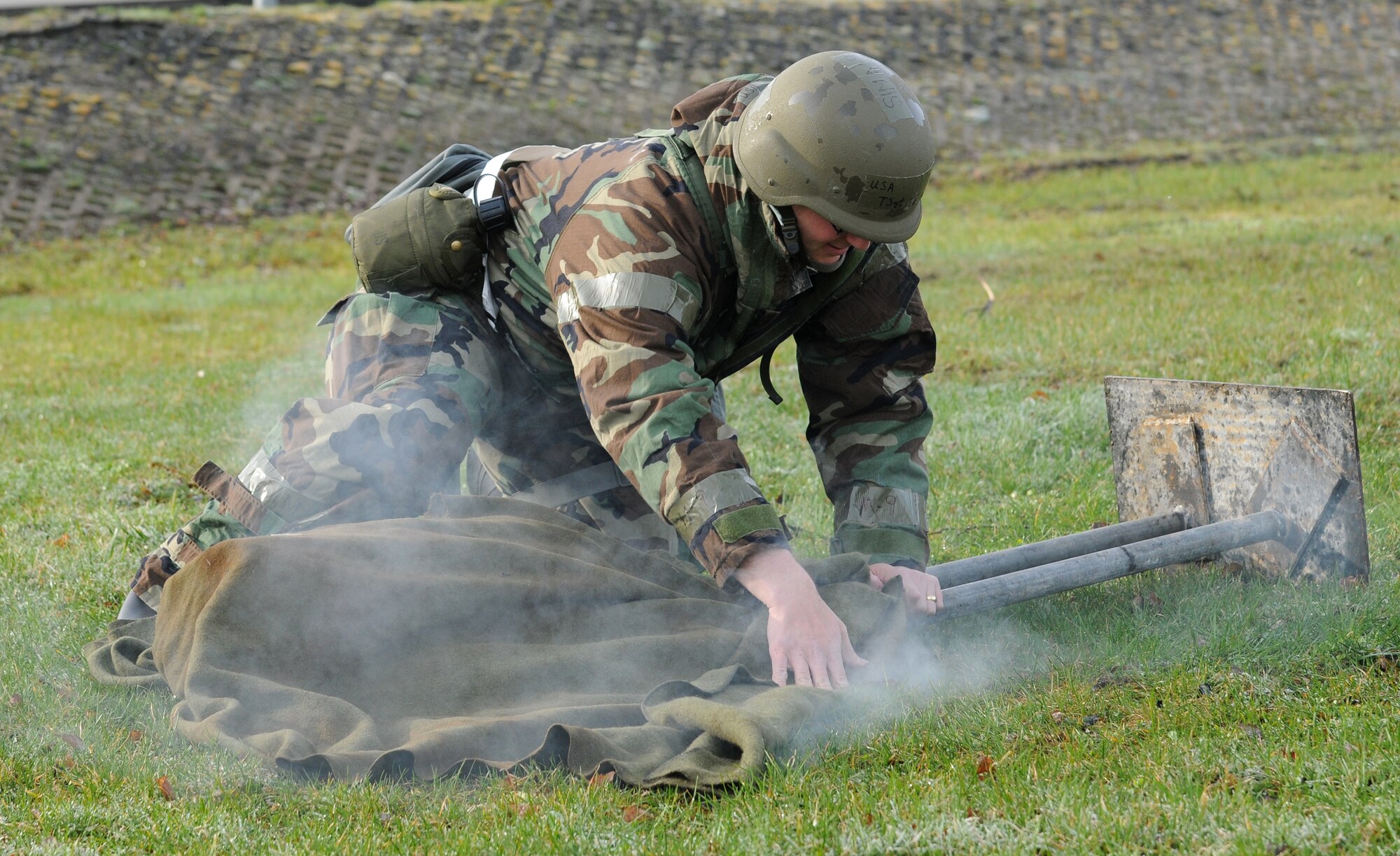 SPANGDAHLEM AIR BASE, Germany – Tech. Sgt. Christopher Thompson, 52nd Fighter Wing Command Post emergency action controller, extinguishes burning dummy during individual core competency skills training April 2. The training reviewed individual chemical, biological, radiological and nuclear defense; weapon proficiency; first aid; post attack reconnaissance and fire fighting to prepare active participants in the NATO Force Evaluation this summer. (U.S. Air Force photo/Senior Airman Nathanael Callon)