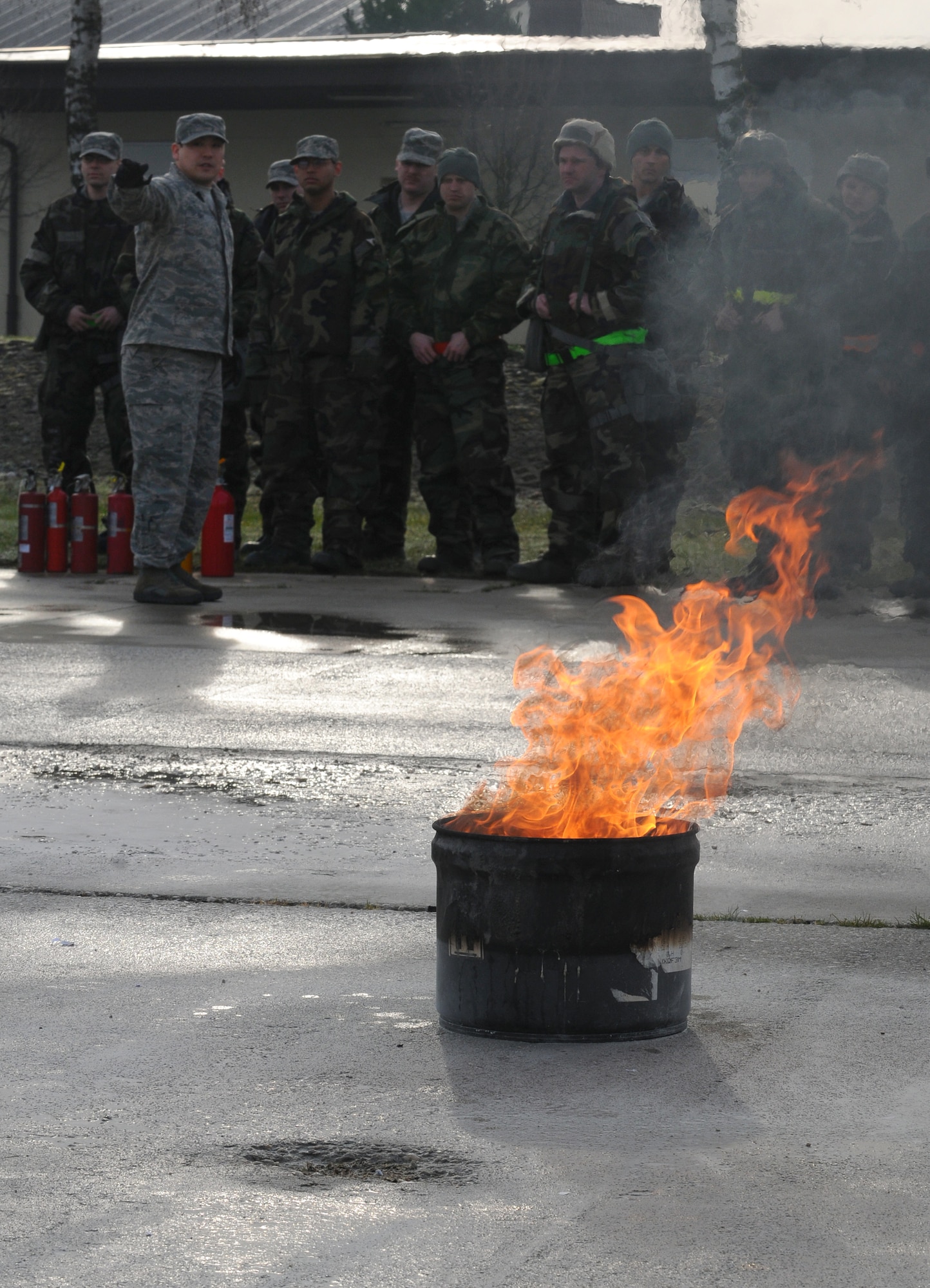 SPANGDAHLEM AIR BASE, Germany – Staff Sgt. Gary Day, 52nd Civil Engineer Squadron firefighter, explains the various classes of fire to students during individual core competency skills training April 2. The training reviewed individual chemical, biological, radiological and nuclear defense; weapon proficiency; first aid; post attack reconnaissance and fire fighting to prepare active participants in the NATO Force Evaluation this summer. (U.S. Air Force photo/Senior Airman Nathanael Callon)