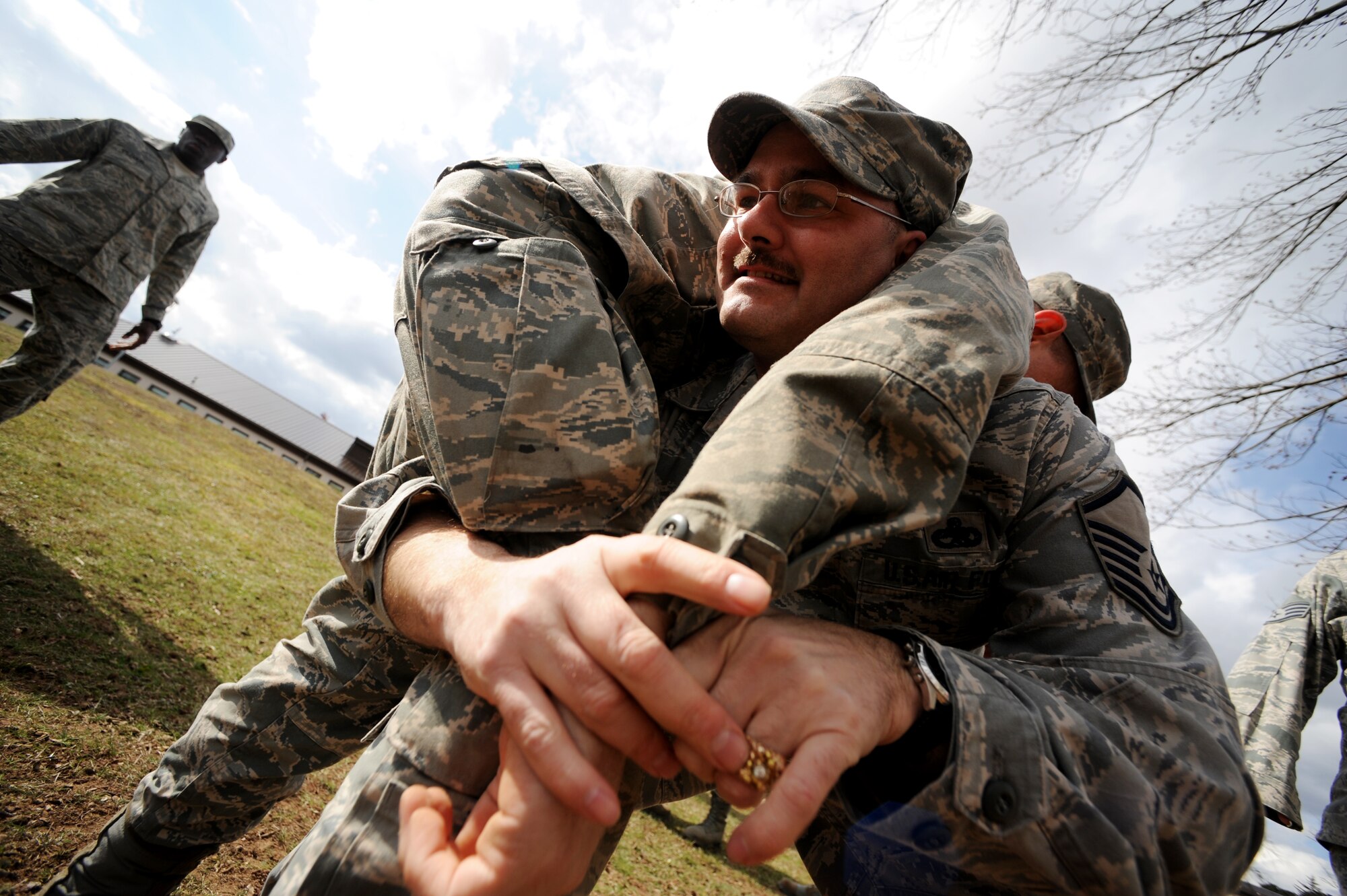 U.S. Air Force Master Sgt. David Mercer, 86th Airlift Wing Staff Agency, unit deployment manager, practices a fireman's carry during self aid and buddy care training in support of the upcoming Operations Readiness Inspection (ORI), April 2, 2010, Ramstein Air Base, Germany. Preparation for the ORI allows Air Force members to build on strengths and indentify weaknesses in order to better support future missions. (U.S. Air Force photo by Tech. Sgt. Sarayuth Pinthong)
