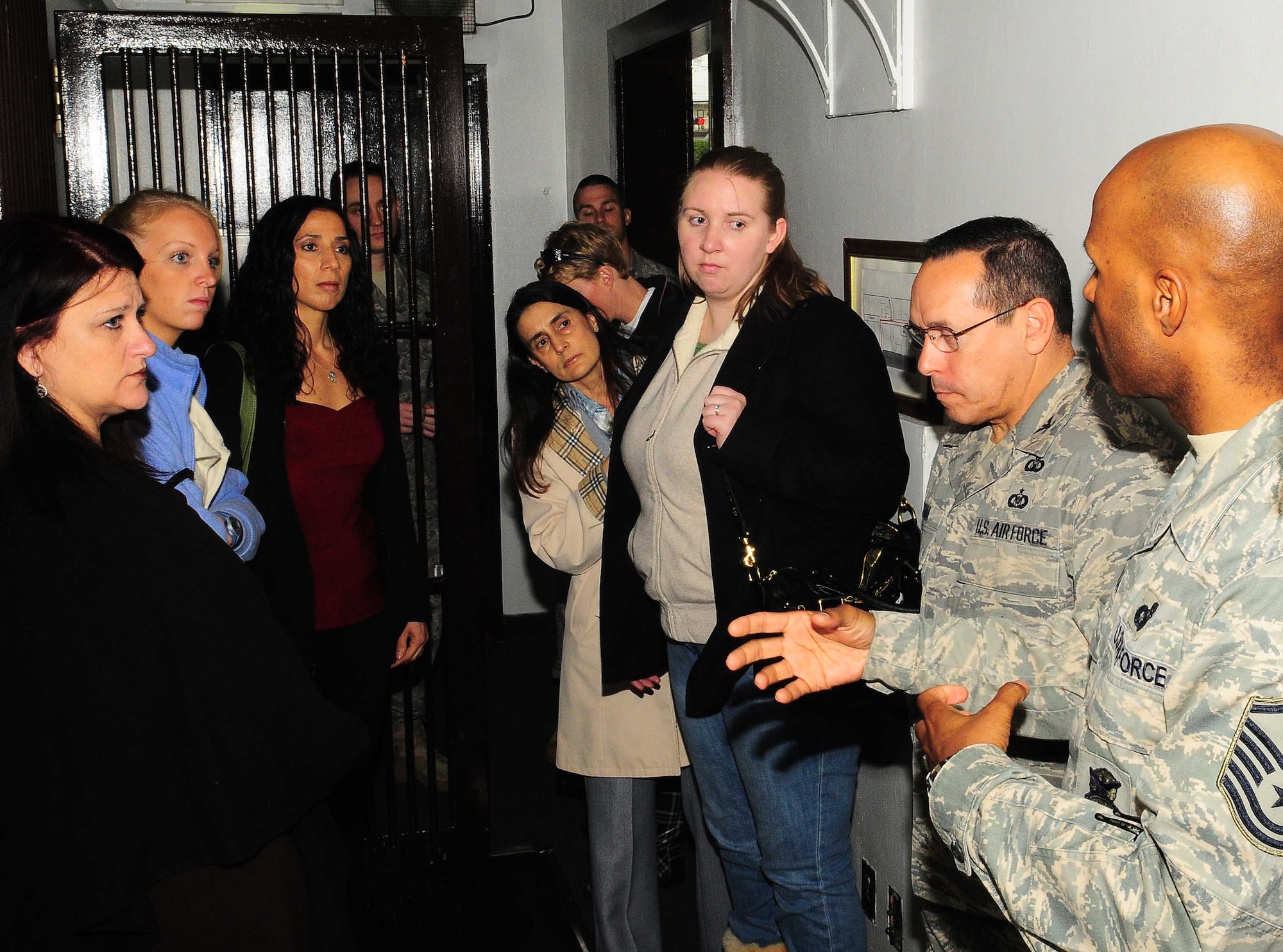 YOKOTA AIR BASE, Japan -- Master Sgt. Elbert Stinson, 374th Security Forces Squadron patrolman, speaks with 374th Mission Support Group spouses at the SFS Base Defense Operations Center March 25, during the 374th MSG spouses orientation. The purpose of the orientation was to provide spouses insight on the day-to-day work of their military sponsors. (U.S. Air Force photo/Airman 1st Class Devin Doskey)