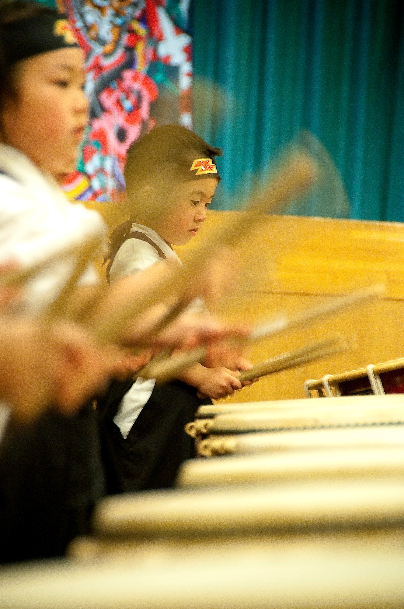 MISAWA AIR BASE, Japan -- A Japanese boy with the Makibano Drummers, plays a Taiko drum during the opening ceremony of Japan Day April 3 at the Tohoku Enlisted Club. The drummers were one of many performances throughout the day. (U.S. Air Force Photo/Staff Sgt. Chad C. Strohmeyer)