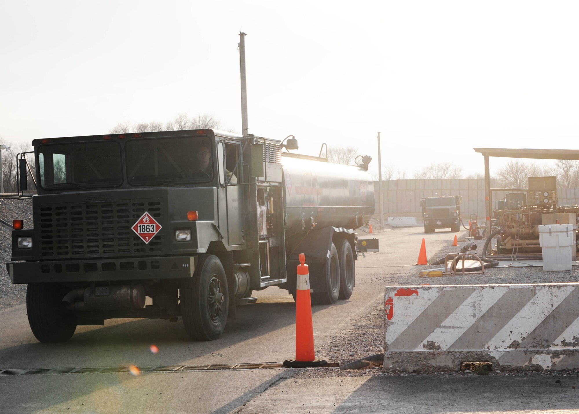 A petroleum, oil and lubricants specialist at the Transit Center at Manas, Kyrgyzstan, drives onto the flight line to issue fuel to aircraft April 2, 2010. In March, the 376th Expeditionary Logistics Readiness Squadron POL flight issued 12,500,102 gallons of gas to cargo, tanker and other combat support aircraft, "fueling the fight." (U.S. Air Force photo/Senior Airman Nichelle Anderson/released)