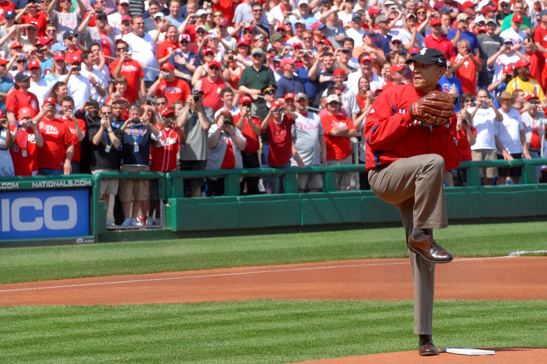 President Barack Obama throws out the ceremonial first pitch to start ...