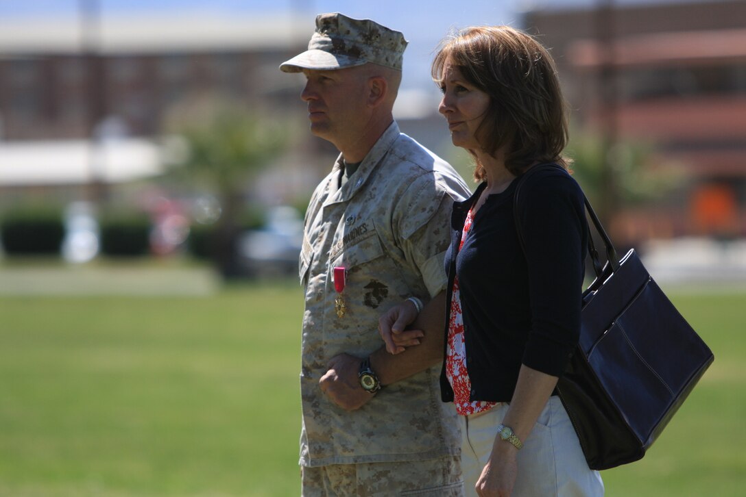 Col. Wes Weston and his wife, Teresa, are piped ashore during Weston’s retirement ceremony April 6 at Lance Cpl. Torrey L. Gray Field.