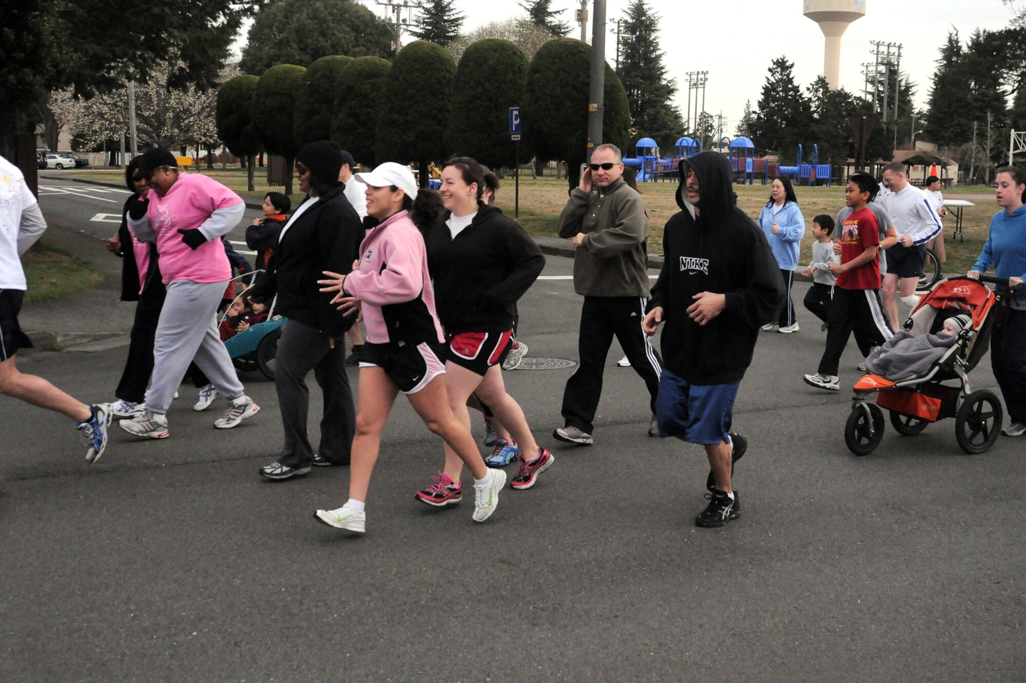 YOKOTA AIR BASE, Japan -- Runners race down the road during the April Awareness Fun Run, April 3, to kickoff Awareness Month. April is recognized as the month of Alcohol Awareness, Child Abuse Prevention and Sexual Assault Awareness. (U.S. Air Force photo/Airman 1st Class Katrina R. Menchaca)