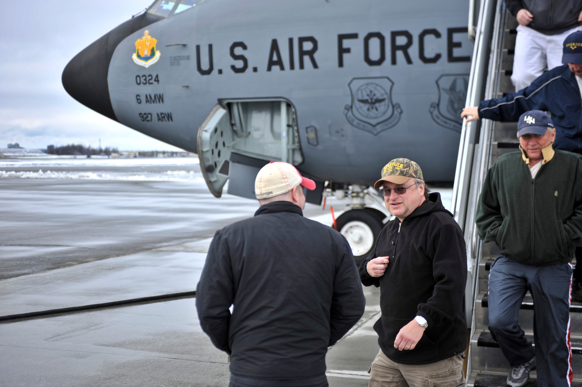 ELMENDORF AIR FORCE BASE, Alaska – Mark Chesnutt, country singer-songwriter, makes his way off of a MacDill AFB KC 135 April 6, while stopping at Elmendorf to refuel. Mr. Chesnutt is en route to Kunsan Air Base where he is expected to perform at Kunsan’s unit compliance inspection after party. One of Mr. Chesnutt’s more notable songs is “Bubba Shot the Jukebox.” (Air Force photo by Airman 1st Class Christopher Gross) 