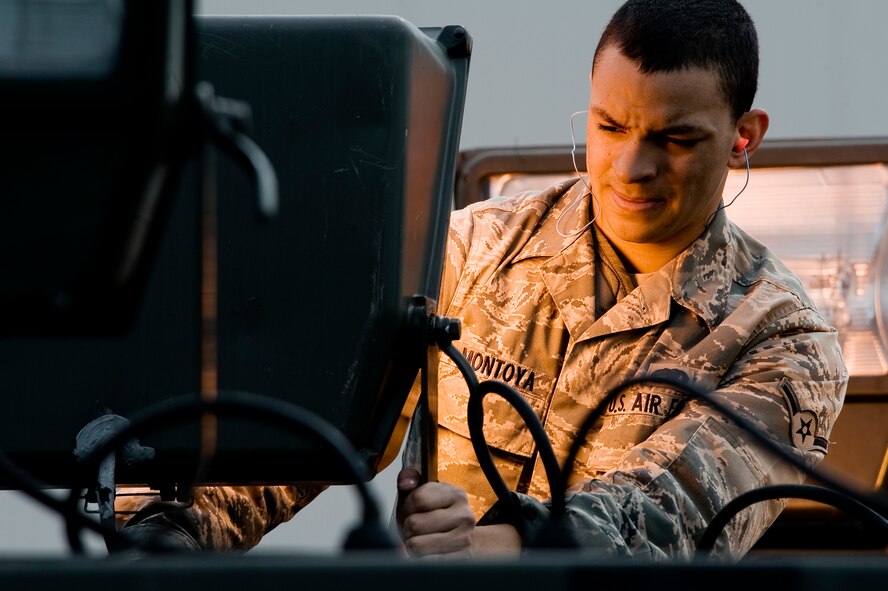 Airman Cody Montoya, an aerospace ground equipment apprentice assigned to the 62nd Maintenance Squadron here, inspects a light cart on the flightline Tuesday Apr 6, 2010 as part of routine inspection of ground equipment. (U.S. Air Force Photo by Abner Guzman)