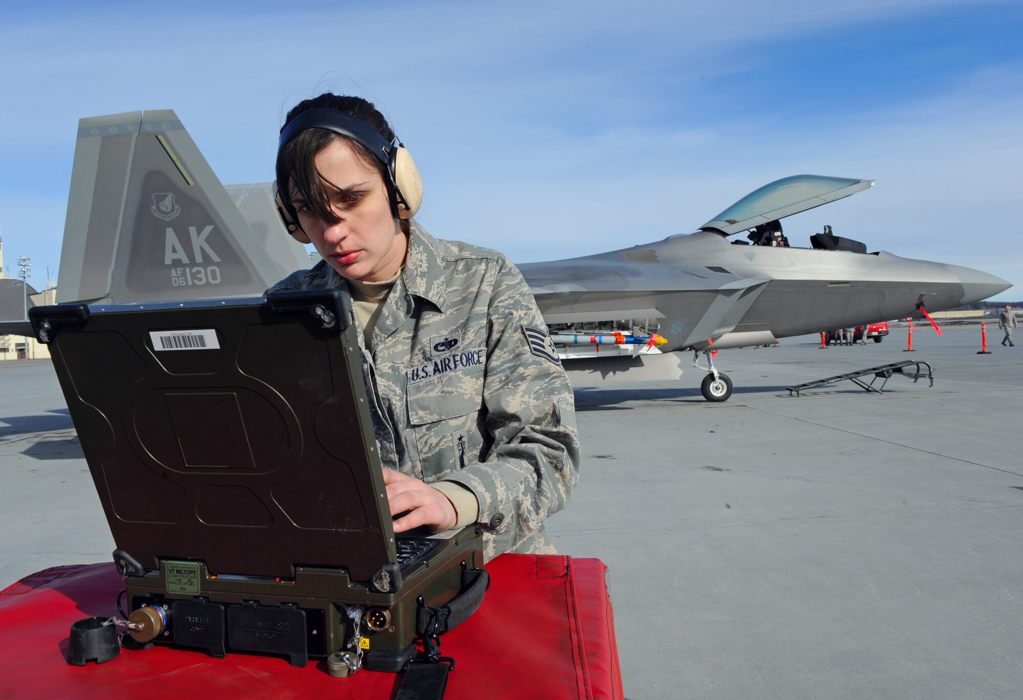 ELMENDORF AIR FORCE BASE, Alaska -- Staff Sgt. Katherine Cook verifies that checklist steps are checked off on the portable maintenance aid after a load is complete during a load competition April 2. Three load teams from the 3rd Wing’s Aircraft Maintenance Units participated in a load crew competition on the flight line. Sergeant Cook is an aircraft armament specialist with the 90th Aircraft Maintenance Unit. (Air Force photo by Senior Airman Cynthia Spalding)

