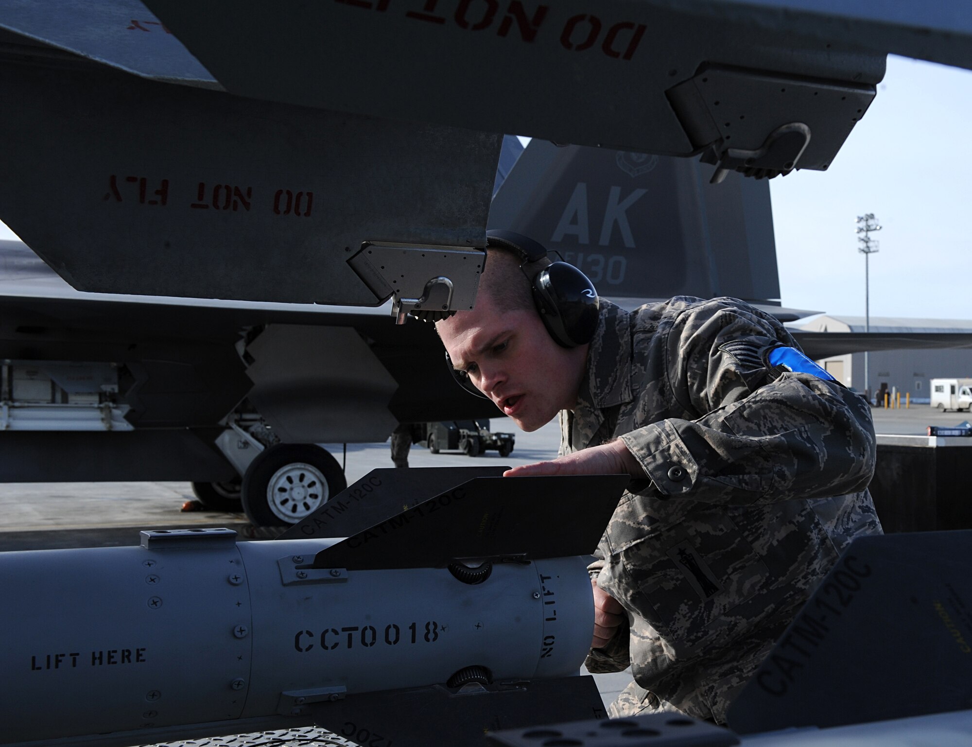 ELMENDORF AIR FORCE BASE, Alaska – Staff Sgt. Coel Lewis ensures that a fin is properly installed on an Air Intercept Missile 120 prior to loading it on an F-15 April 2. Three load teams from the 3rd Wing’s Aircraft Maintenance Units participated in a load crew competition on the flight line. Sergeant Lewis is an aircraft armament specialist with the 19th Aircraft Maintenance Unit. (Air Force photo by Senior Airman Cynthia Spalding)