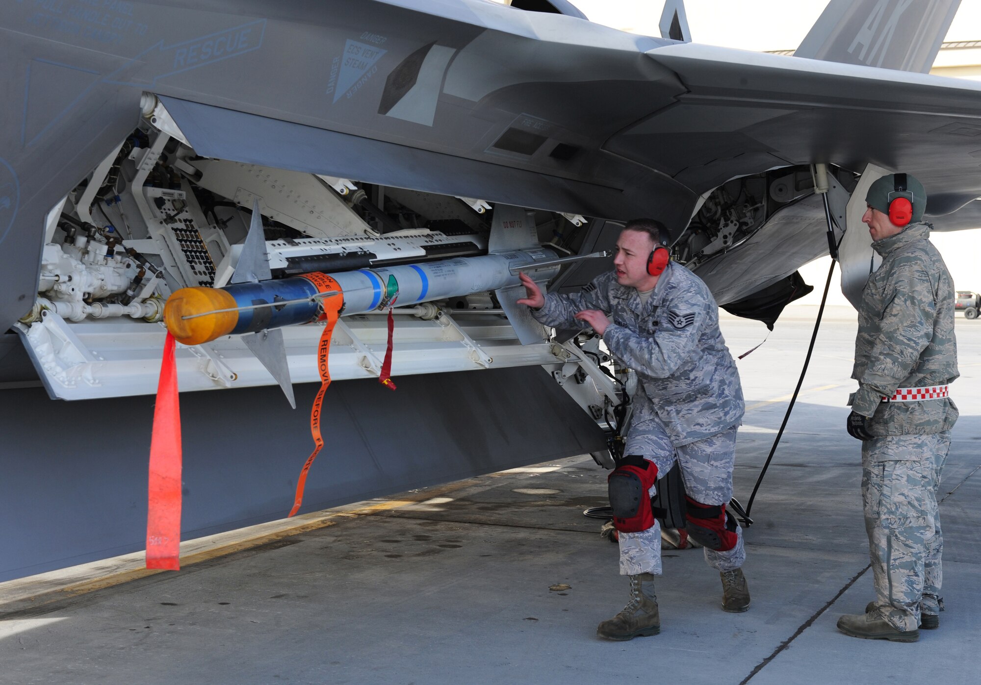 ELMENDORF AIR FORCE BASE, Alaska -- Staff Sgt. Richard Howard performs a post load inspection while being evaluated by a weapons standardization team member during the load crew competition April 2. The 525th Aircraft Maintenance Unit took first place in the competition. Sergeant Howard is an aircraft armament specialist with the 525th AMU. (Air Force photo by Senior Airman Cynthia Spalding)