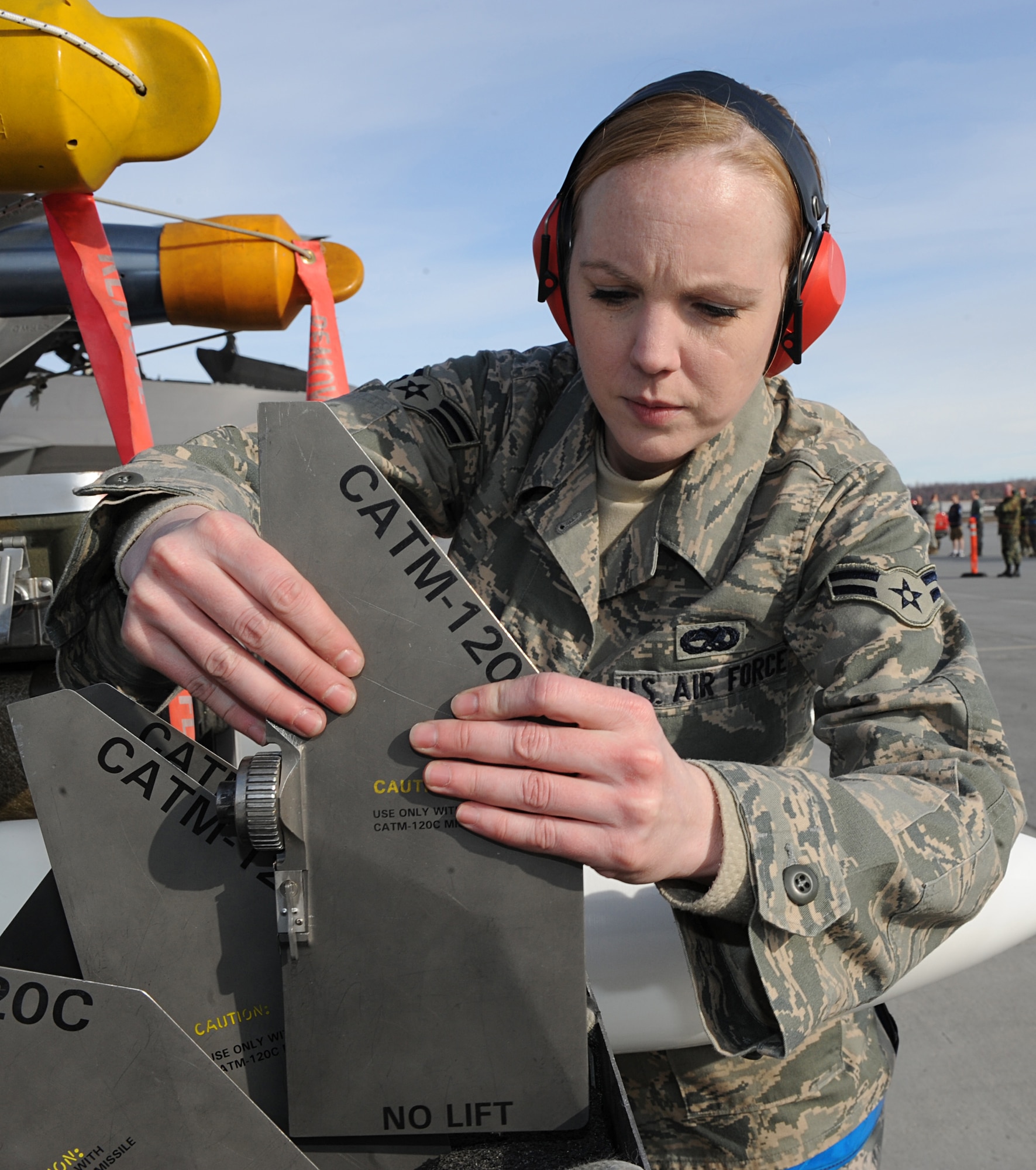 ELMENDORF AIR FORCE BASE, Alaska -- Airman 1st Class Sara Rogers performs a fin inspection during a munitions preperation prior to loading an F-22 during the load crew competition April 2. The 525th Aircraft Maintenance Unit took first place in the competition. Airman Rogers is an aircraft armament specialist with the 525th AMU. (Air Force photo by Senior Airman Cynthia Spalding)