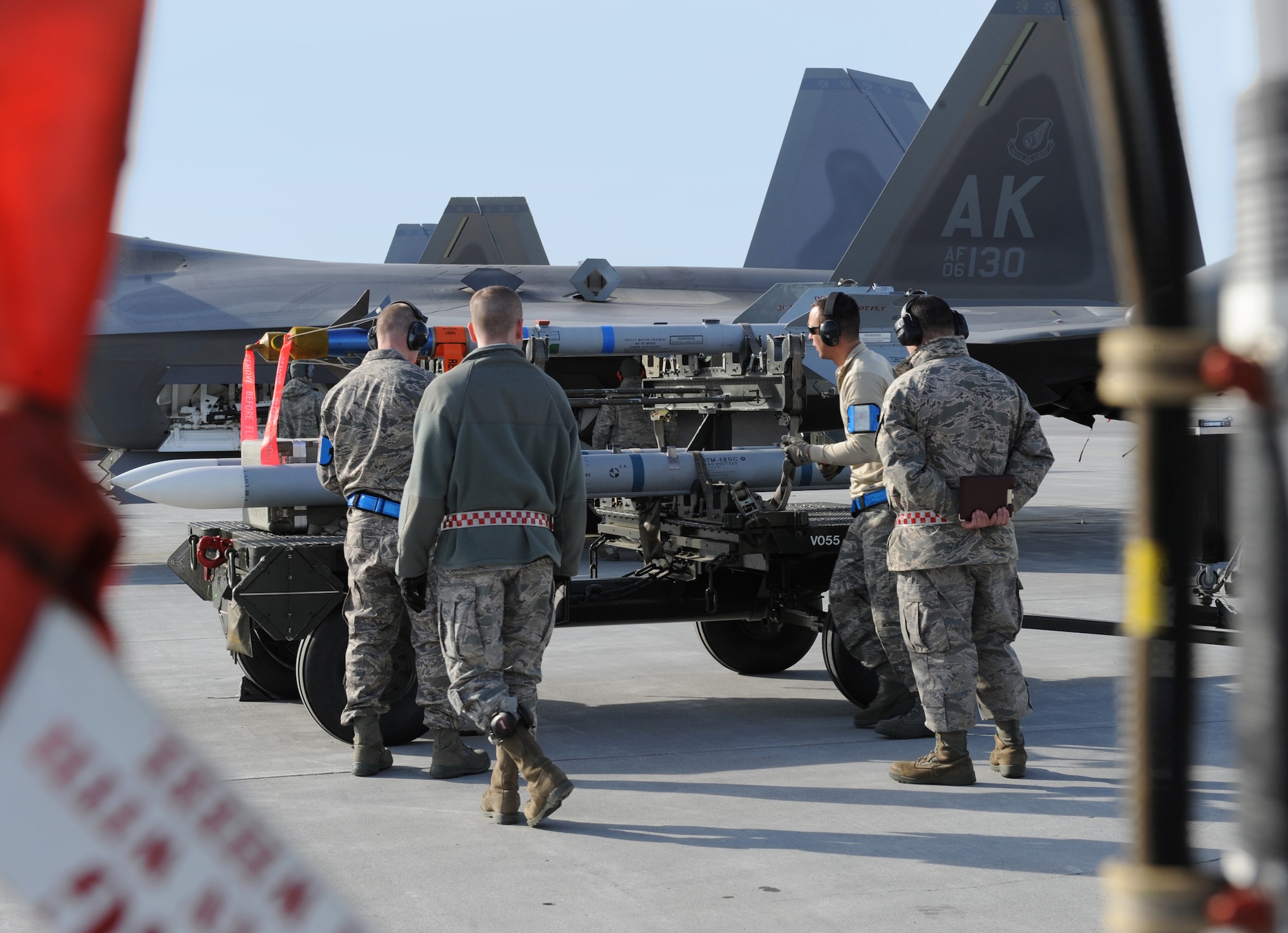 ELMENDORF AIR FORCE BASE, Alaska -- A 19th Aircraft Maintenance Unit's load crew team performs a missile inspection while being evaluated by the weapons standardization team during a load competition April 2. According to Master Sgt. Donald Flournoy, load competitions increase load crew efficiency and build a sense of camaraderie for weapons troops. (Air Force photo by Senior Airman Cynthia Spalding)