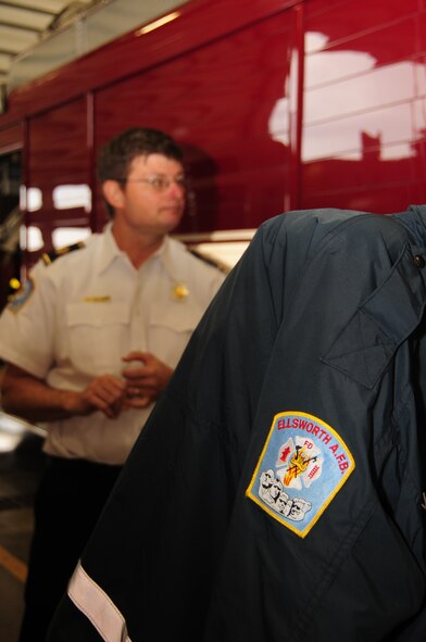 ELLSWORTH AIR FORCE BASE, S.D. -- David Olsen, 28th Civil Engineer Squadron fire chief, gives a tour of the fire station to Lt. Col. Matthew Joganich, 28 CES commander, April 5.  Firefighters are on a 24-hour rotation and view the fire station as a home away from home. (U.S. Air Force photo/Airman 1st Class Anthony Sanchelli)