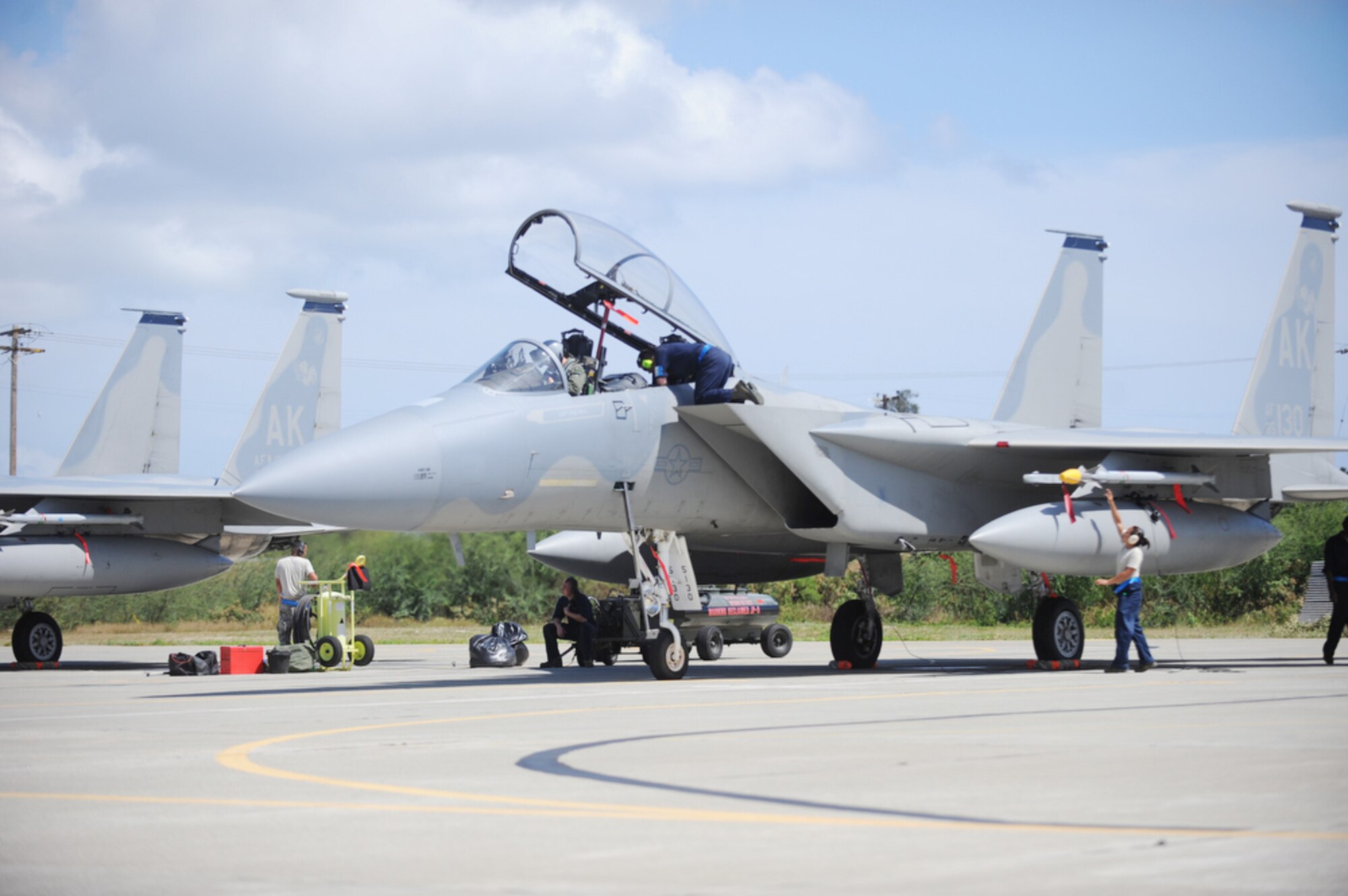 Airmen conduct an inspection before clearing the F-15 Eagle for the next stage of checks March 23, 2010 while deployed to Joint Base Pearl Harbor-Hickam, Hawaii. The Airmen are assigned to the 19th Aircraft Maintenance Unit, 3rd Maintenance Squadron at Elmendorf Air Force Base, Alaska. (U.S. Air Force photo/Tech. Sgt. Cohen A. Young)