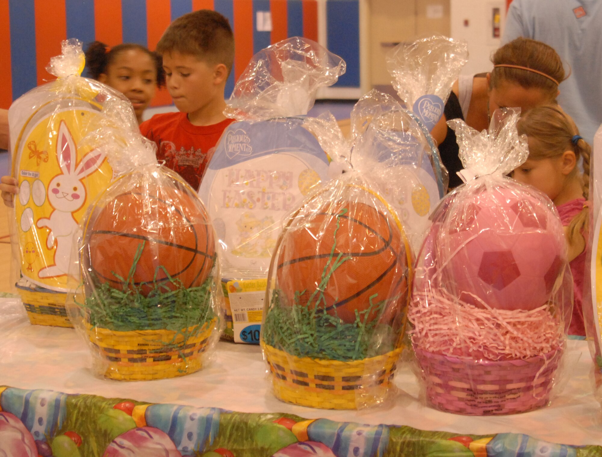Kids redeem their prizes at the Base Wide Egg Hunt held at Goodfellow AFB, April 3. Prize tickets were hidden in the eggs. ( U.S. Air Force photo/Airman 1st Class Anne Gathua )