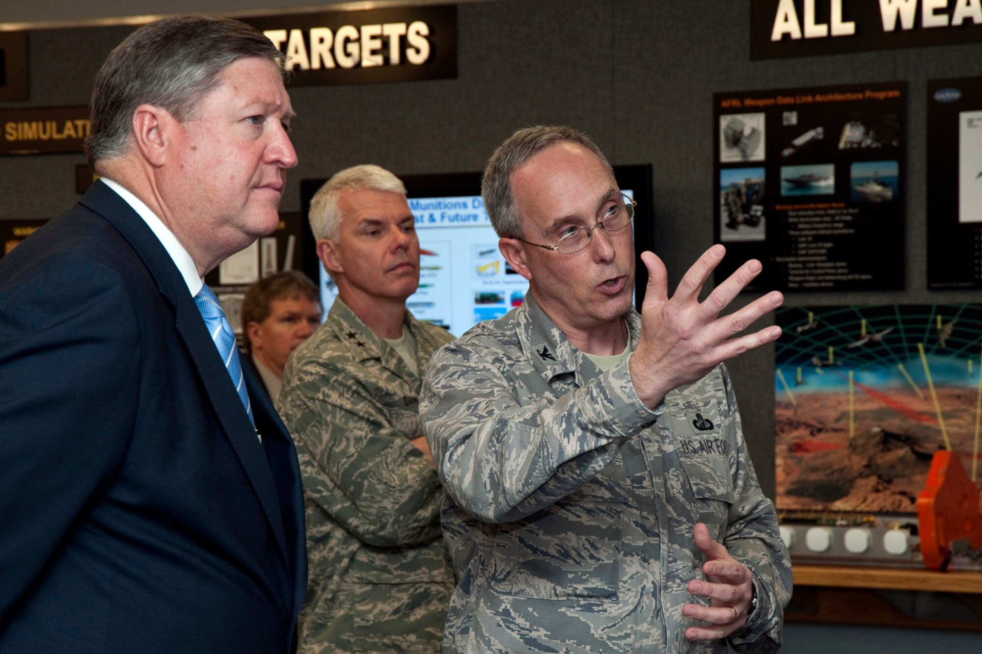EGLIN AIR FORCE BASE, Fla. -- Col. Kenneth Echternacht, Jr., Air Force Research Laboratory commander, explains the displays located at the Lab's Tacomi Room to Secretary of the Air Force Michael Donley during his visit here April 2.  The SECAF spent the day at Eglin visiting each of the major wings and talking with base leadership and Airmen.  (Courtesy photo)
