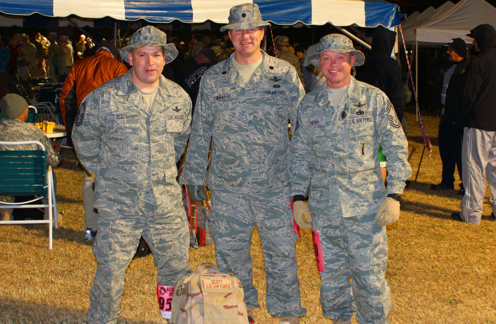 Senior Master Sgt. Jeffery Scott, operations superintendent for the 380th Space Control Squadron, left, Lt. Col. Paul Tombarge, center, the commander of the 16th Space Control Squadron, and Chief Master Sgt. Robert Cherry, squadron superintendent for the 380th Space Control Squadron, stop for a photo before beginning the 2010 Bataan Memorial Death March.