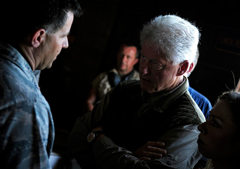 Former U.S. President Bill Clinton discusses relief efforts with U.S. Air Force Col. Buck Elton, commander of Special Operations Command South Forward-Haiti, Jan. 18 in Port-au-Prince, Haiti. Clinton, the U.S. envoy to Haiti, was surveying damage caused by the earthquake that devastated the city Jan. 12, and relief efforts in support of the natural disaster. (U.S. Air Force photo by Master Sgt. Russell E. Cooley IV/Released) 