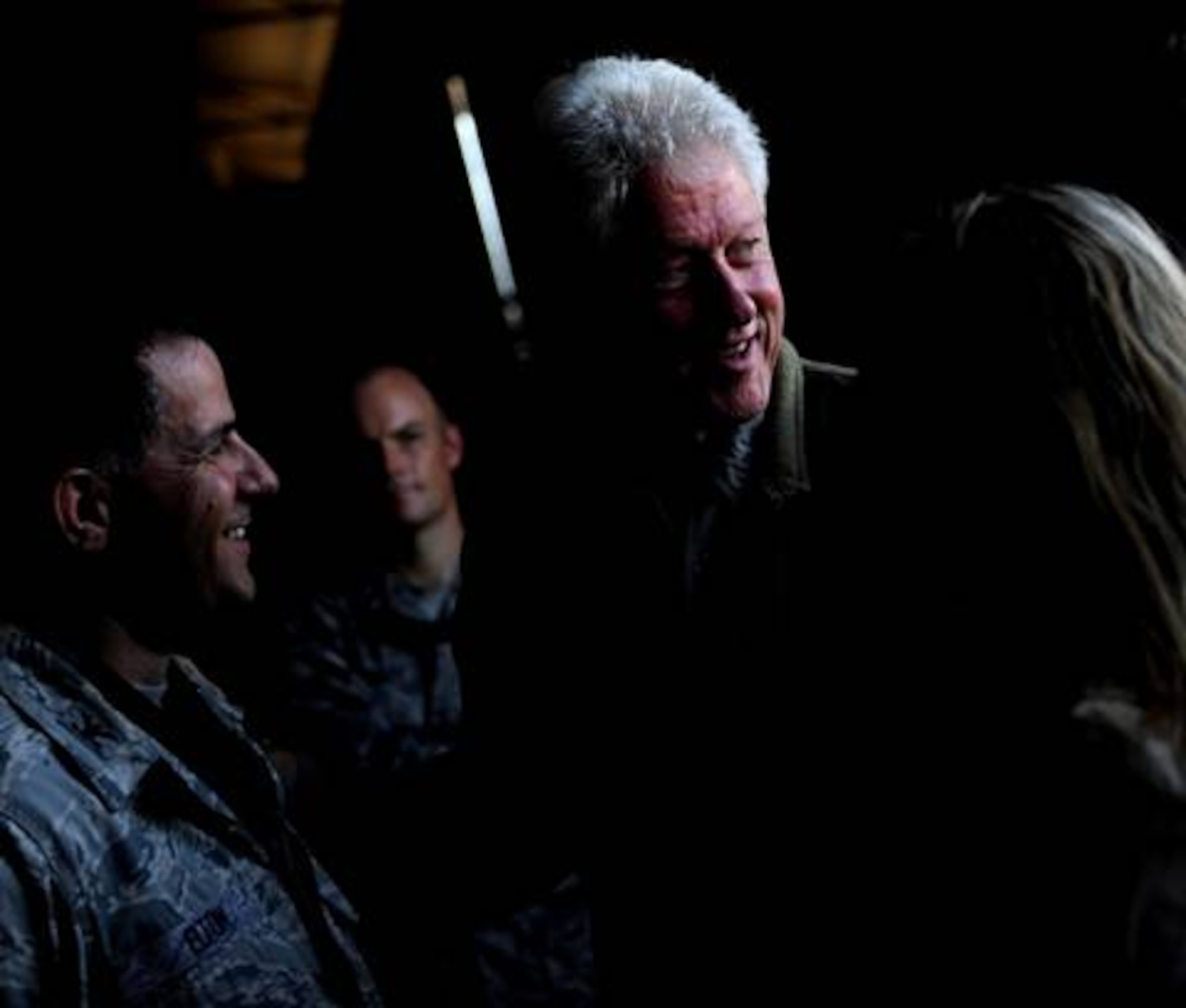 Former U.S. President Bill Clinton discusses relief efforts with U.S. Air Force Col. Buck Elton, commander of Special Operations Command South Forward-Haiti, Jan. 18 in Port-au-Prince, Haiti. Clinton, the U.S. envoy to Haiti, is surveying damage caused by the earthquake that devastated the city Jan. 12, and relief efforts in support of the natural disaster. (U.S. Air Force photo by Master Sgt. Russell E. Cooley IV/Released)