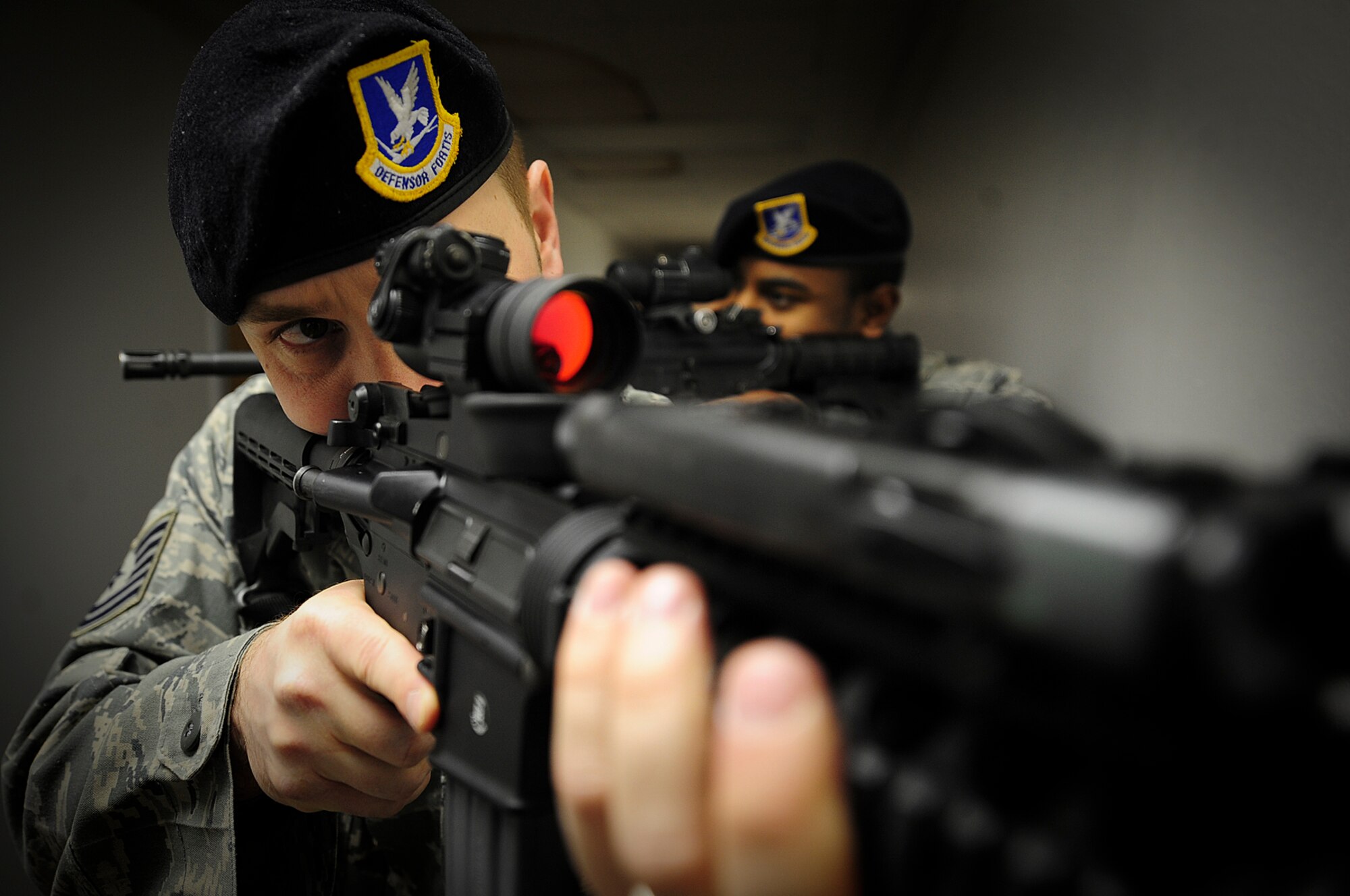 ELLSWORTH AIR FORCE BASE, S.D. - (Front to back) Tech. Sgt. Joel Meyer and Staff Sgt. Derek Walton, 28th Security Forces Squadron members, train on room-clearing tactics, April 5. Sergeant Meyer was selected as the 2009 Security Forces Air Force NCO of the Year partly due to his leadership abilities, both at Ellsworth and during deployments. (U.S. Air Force photo/Airman 1st Class Joshua J. Seybert)