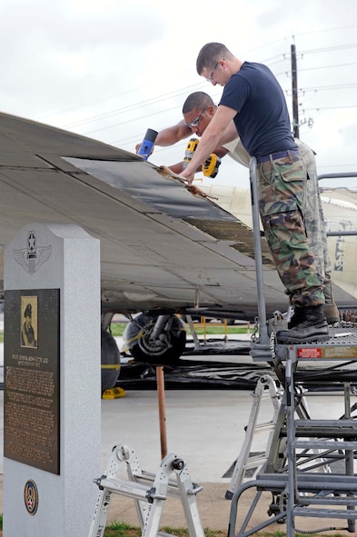 BARKSDALE AIR FORCE BASE, La. -- Airmen 1st Class Bronson Bohannon (right) and Avondries Green, 2d Maintenance Squadron aircraft structural maintainers, install rivets on new sheet metal wing flaps April 5. The Airmen are assisting, along with other Barksdale Airmen and contractors, with the restoration of a B-17 aircraft in honor of Maj. Gen. Lewis E. Lyle who was a World War II combat pilot. (U.S. Air Force photo by Staff Sgt. John Gordinier)
