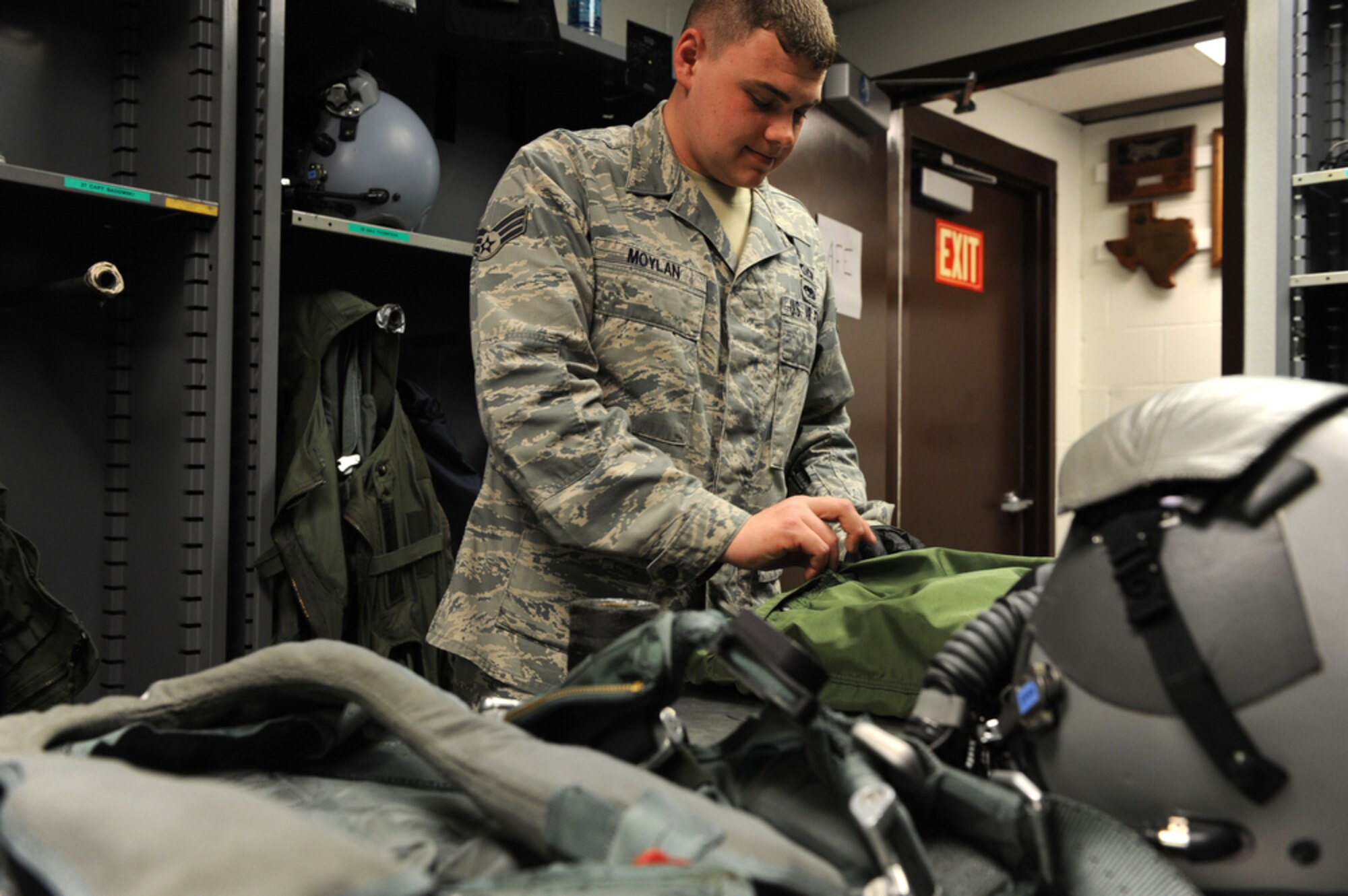 JOINT BASE PEARL HARBOR-HICKAM, Hawaii - Senior Airman Kenny Moylan, an aircrew flight equipment journeyman with the 19th Fighter Squadron, Elmendorf AFB, Alaska conducts an inspection of safety equipment for an incentive flyer on March 23, while at Joint Base Pearl Harbor-Hickam, Hawaii. Airman Moylan ensures that helmets, masks, oxygen devices, life rafts, G-suits, parachutes and harnesses will operate correctly for the pilots of the 19th FS while they participate in training exercise with the 199th FS of the Hawaii Air National Guard. (Air Force photo by Tech. Sgt. Cohen A. Young)