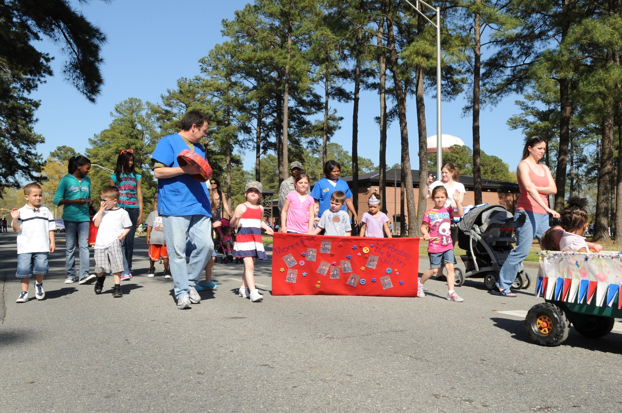 SEYMOUR JOHNSON AIR FORCE BASE, N.C. -- More at Four Partnership for Children in Wayne County marches with military families honoring the "Month of the Military Child" in a parade here, April 1, 2010. Former Defense Secretary Caspar Weinberger established April as the "Month of Military Child" in 1986. (U.S. Air Force photo/Staff Sgt. Courtney Richardson)