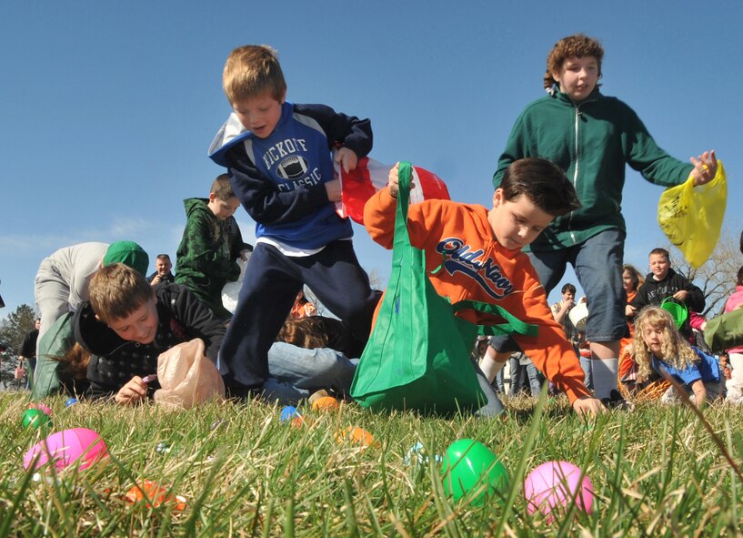 OFFUTT AIR FORCE BASE, Neb. -- Many children from the Offutt community rush and stumble to find their favorite eggs at Offutt's annual Easter egg hunt at the Base Lake April 3. The event was one of several military families took part in during the holiday weekend. U.S. Air Force Photo by Jeff W. Gates