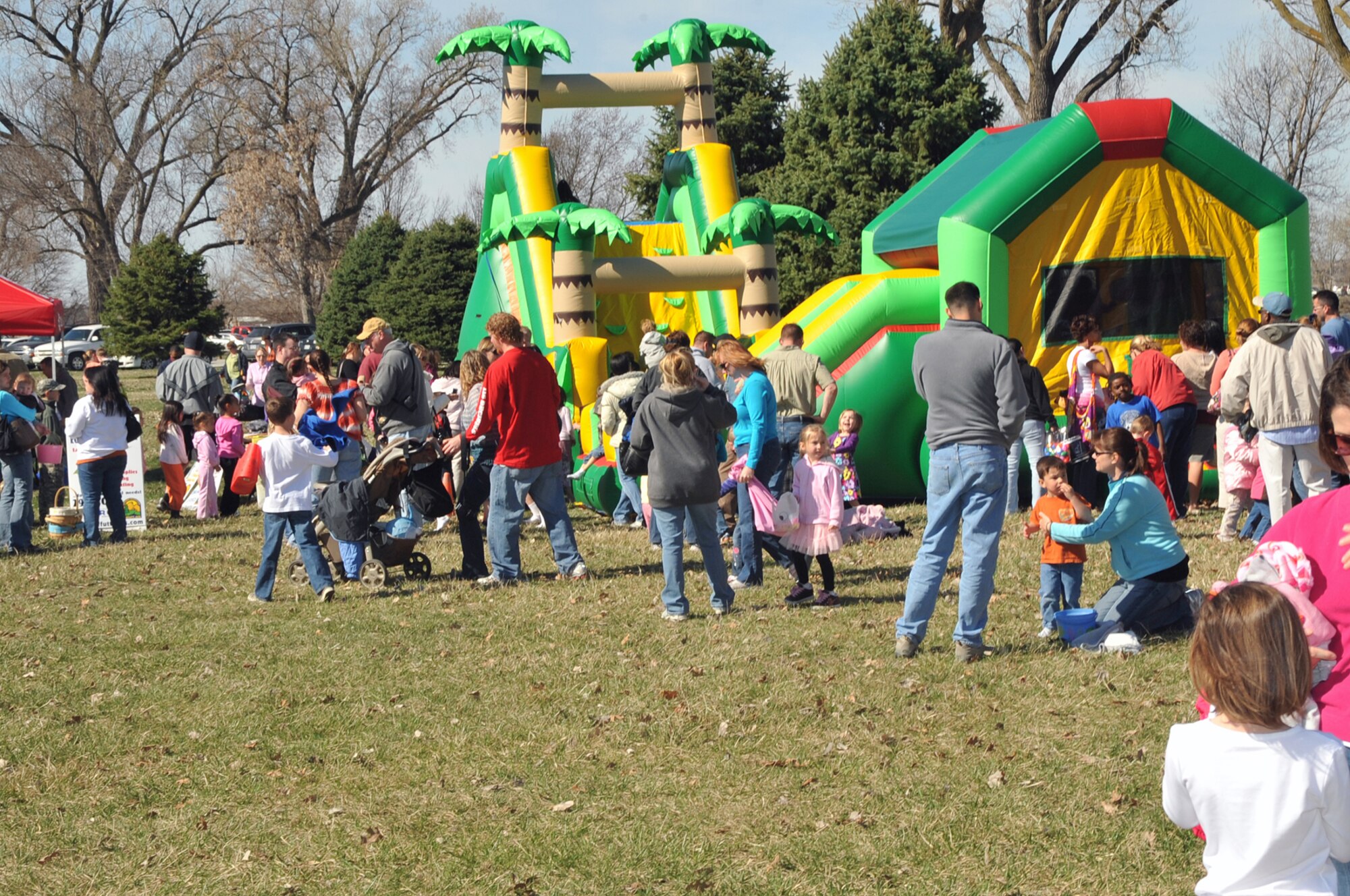 OFFUTT AIR FORCE BASE, Neb. -- Many members of the Offutt Community gather at the Base Lake April 3 for Offutt's annual Easter egg hunt. Bounce houses were featured at the event, which was one of several military families took part in during the holiday weekend. U.S. Air Force photo by Jeff W. Gates
