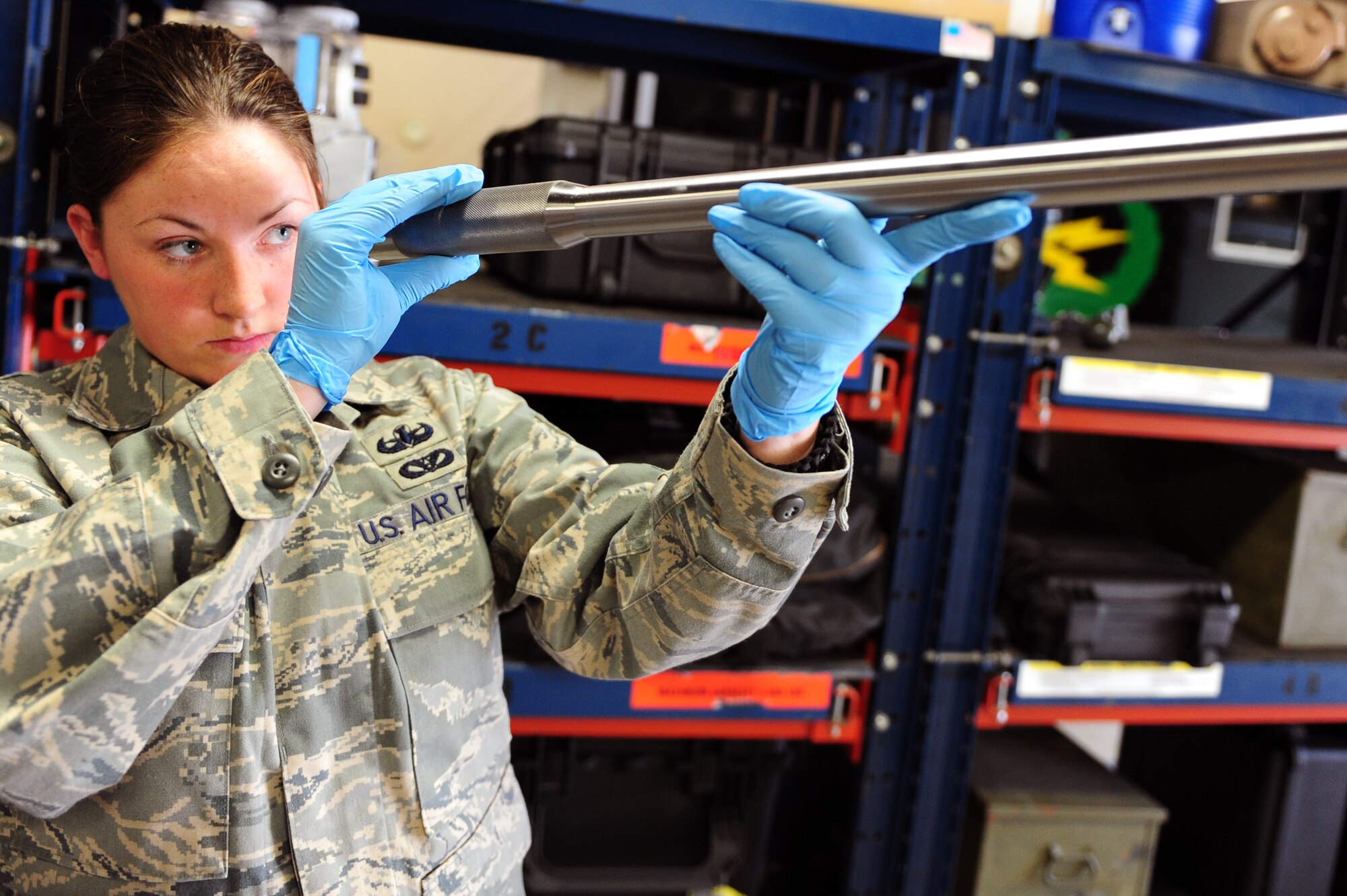 Senior Airman Ashley Miller, 19th Civil Engineer Squadron explosive ordnance disposal journeyman, inspects a tool used for a disruption system March 18 on base. Tools used for EOD operations are maintained at all times in the event of a real-world alert. (U.S. Air Force photo by Senior Airman Steele C. G. Britton)