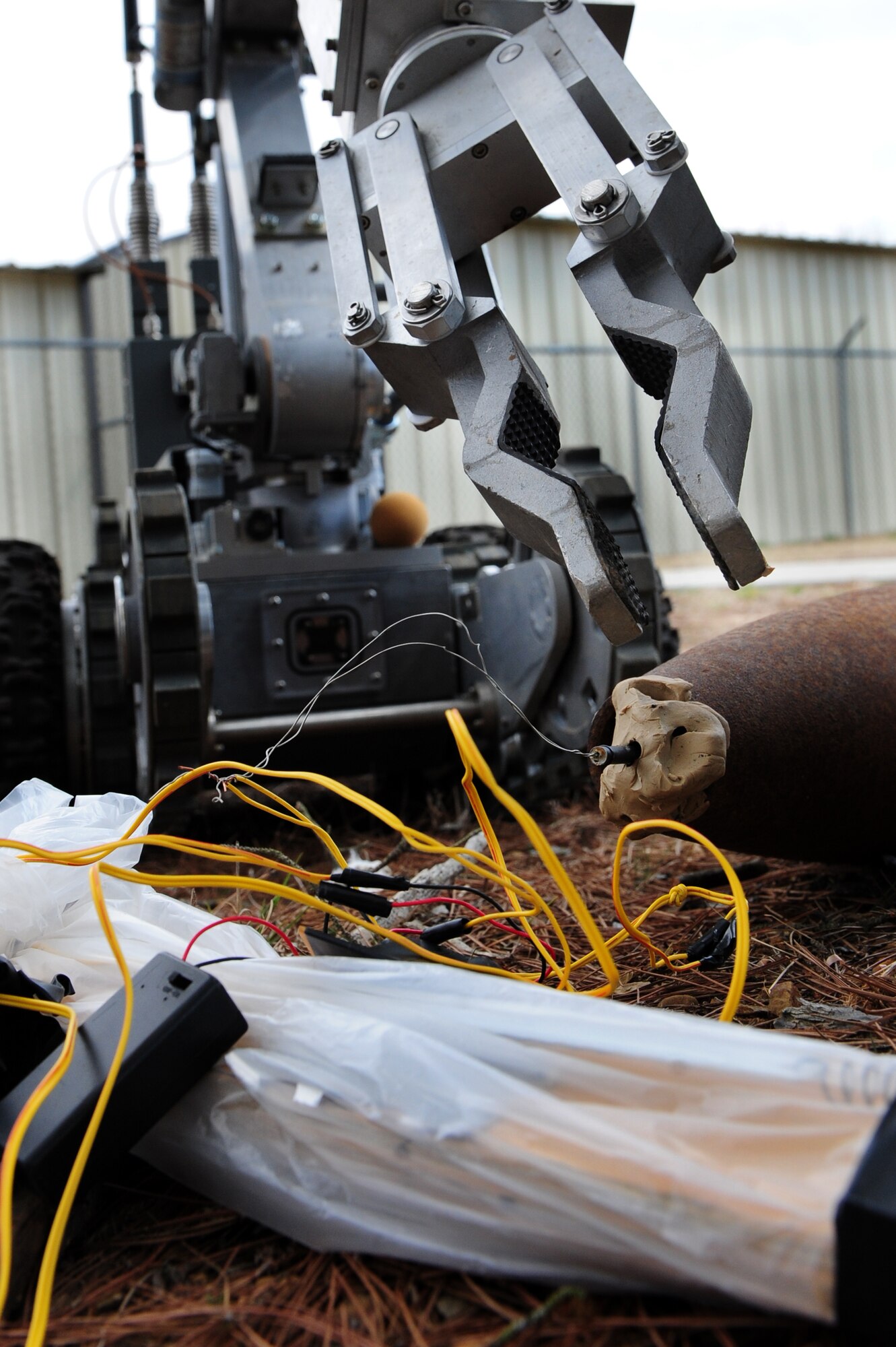 LITTLE ROCK AIR FORCE BASE, Ark. – A reconnaissance and disposal robot prepares to disarm an improvised explosive device during an exercise March 18 on base. Robots are a safe way for EOD experts to perform the job without being in harm’s way. (U.S. Air Force photo by Senior Airman Steele C. G. Britton)