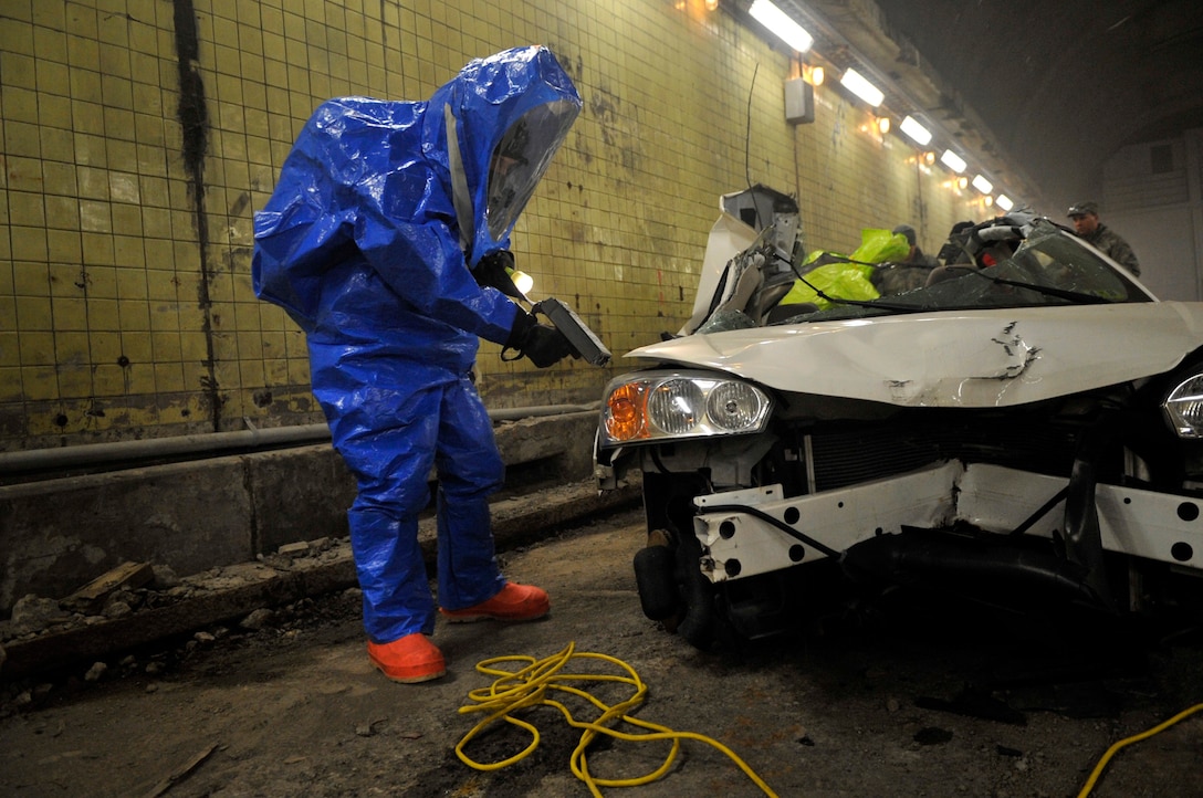 Airman 1st Class Samuel Mericle performs a radial survey to determine radiation levels after a simulated explosion in front of the Base Exchange during a training scenario at the Center for National Response in Gallagher, W.Va., March 24, 2010. The Air Force District of Washington sent members of their chemical, biological, radiological, nuclear, and high yield explosives response force to the training facility in two waves for a week long training event to members learn the skills necessary to handle real world emergency situations. (U.S. Air Force photo by Staff Sgt. Renae L. Saylock)