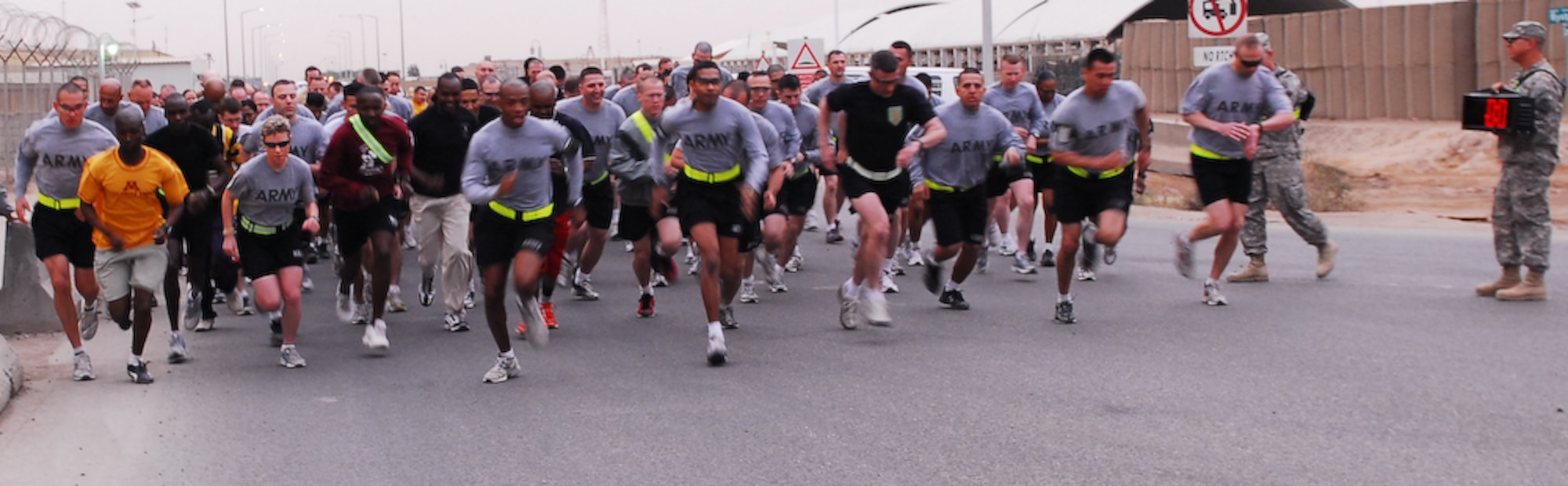 CONTINGENCY OPERATING BASE BASRA, Iraq -- Over 100 participants dash off, trying to gain the lead, at the start of this year's Molly Pitcher 5k run, held March 21.
(U.S. Army photo/Spc. Maurice A. Galloway)